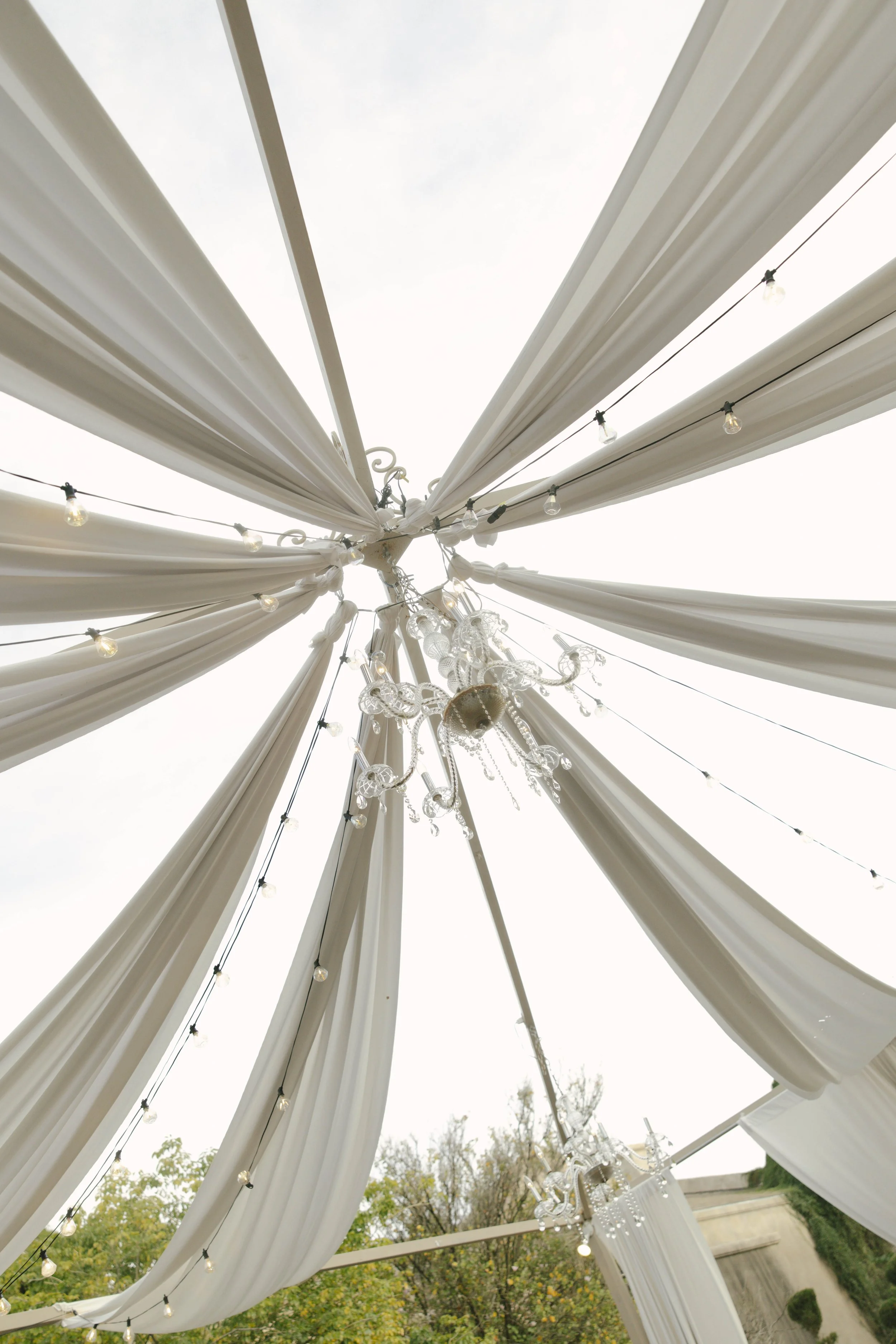 The wedding processional at Ashley Castle in Chandler, Arizona, was captured through hybrid film and digital photography, preserving the graceful entrances of the bridal party as they made their way through the romantic outdoor ceremony space surroun