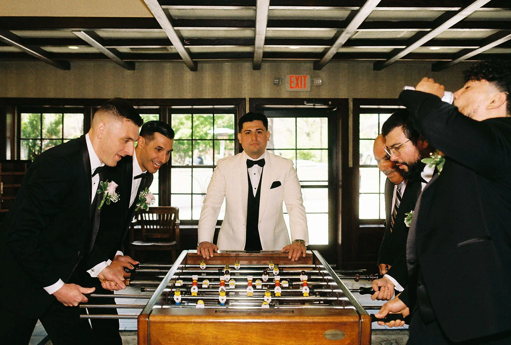 Groom getting ready at Hotel DuVillage before Andy & Elmer's May 2026 wedding. Captured by Raw By Laura using a blend of digital and 35mm film photography, documenting genuine moments with family and friends.