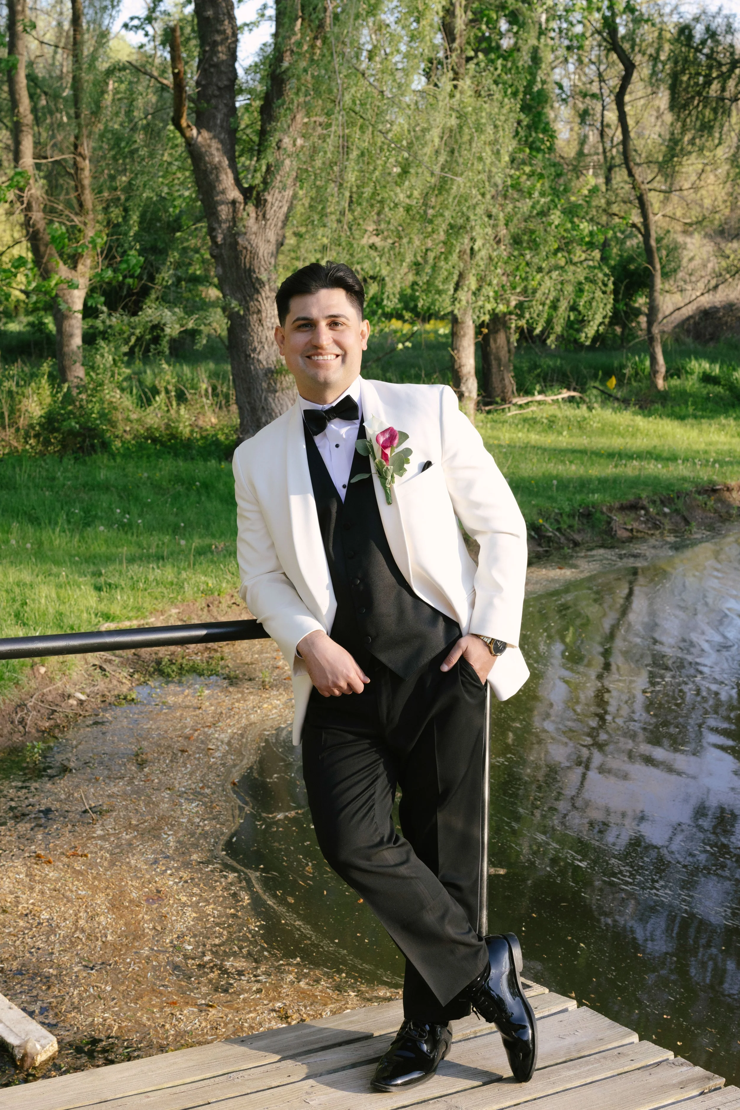 Bride and groom portraits at Hotel DuVillage showcase the venue's picturesque gardens, waterfront views, and timeless charm. Photographed on both digital and 35mm film, these wedding portraits focus on authentic connection, natural movement, and cand