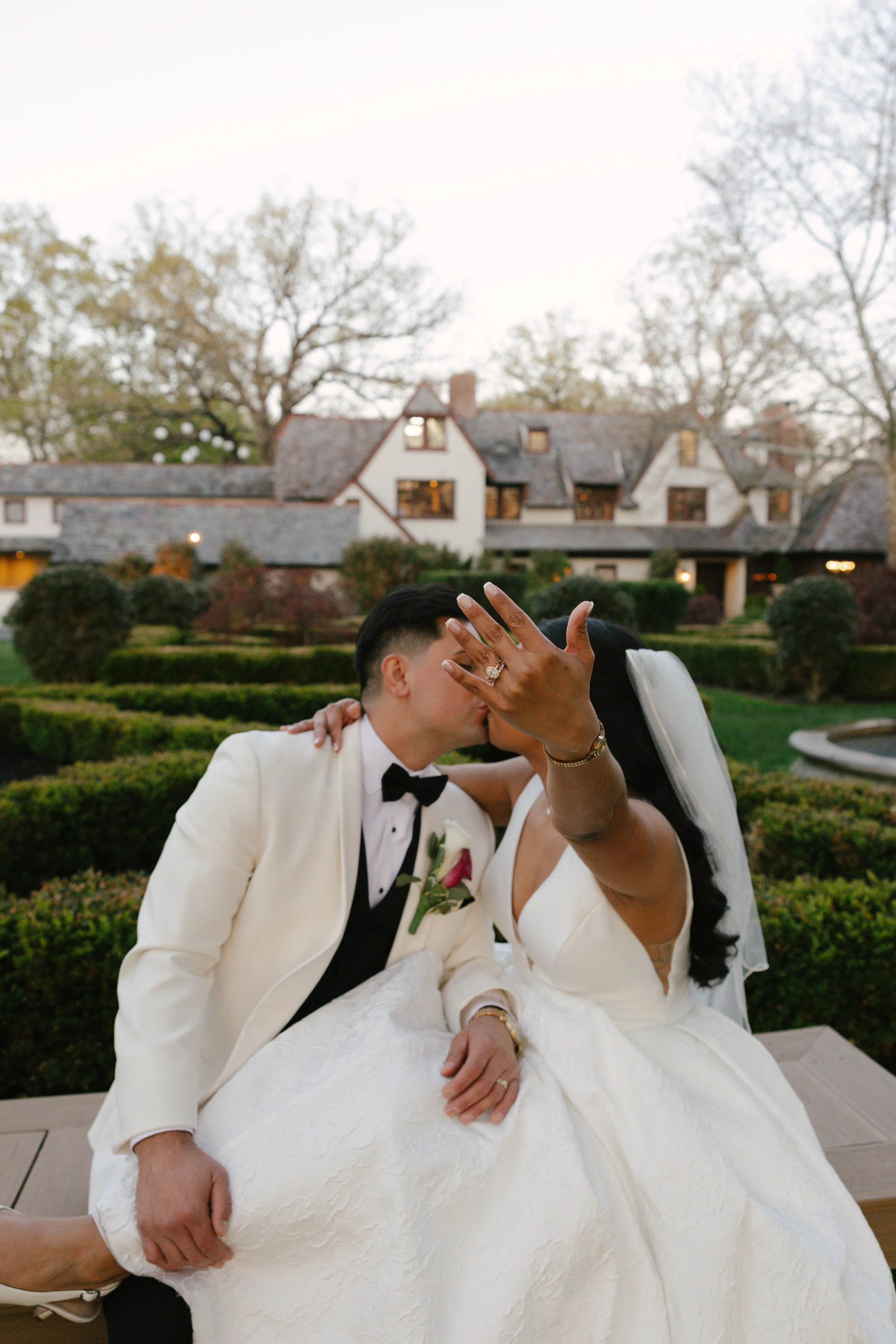 As the sun began to set, the bride and groom stepped away for golden hour portraits around the grounds of Hotel DuVillage. Captured on both digital and 35mm film, these sunset portraits highlight the warmth, romance, and quiet moments shared between 