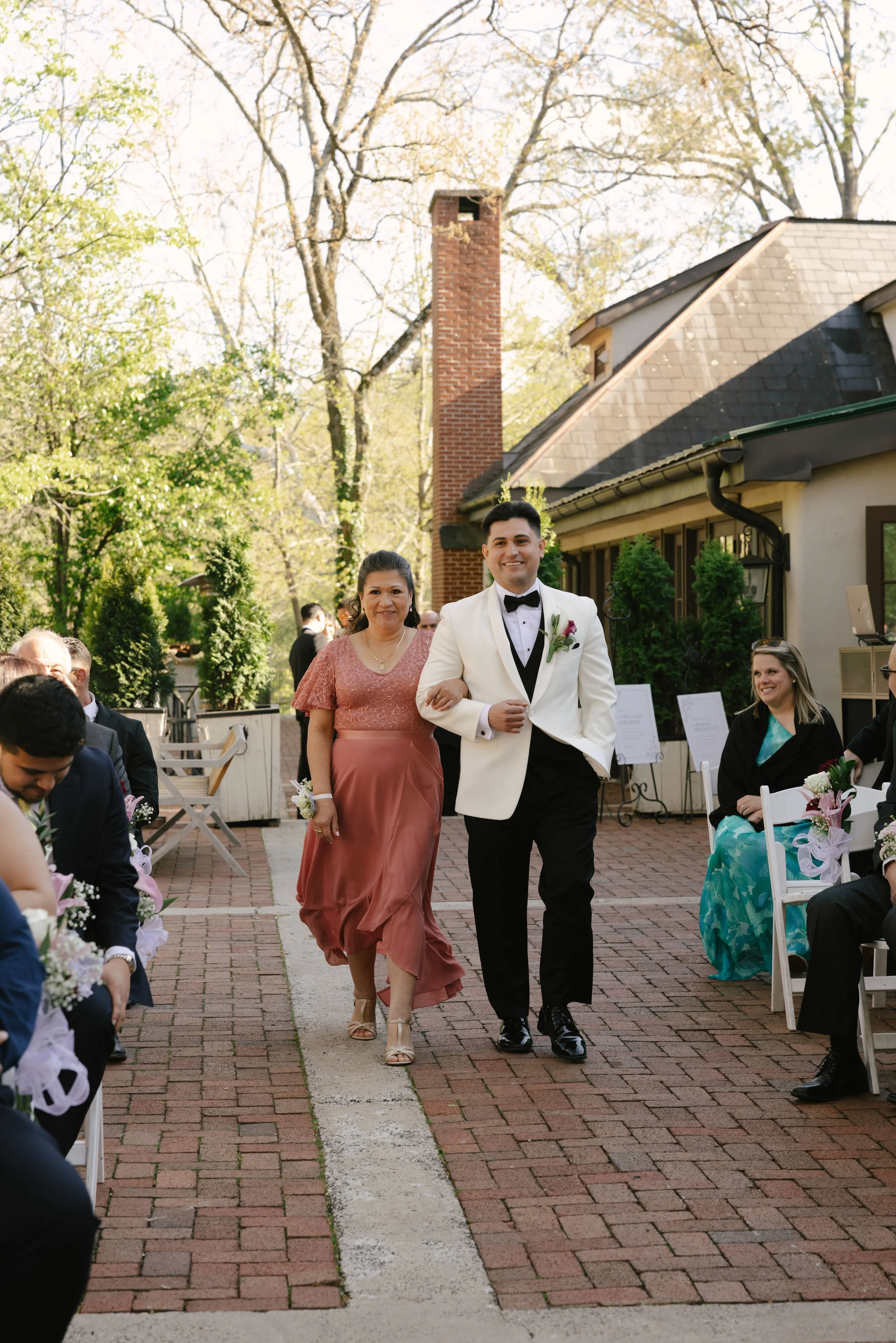 Outdoor wedding ceremony at Hotel DuVillage featuring the bride and groom, wedding party, and meaningful moments captured on both digital and 35mm film. A timeless celebration documented with a candid, documentary approach