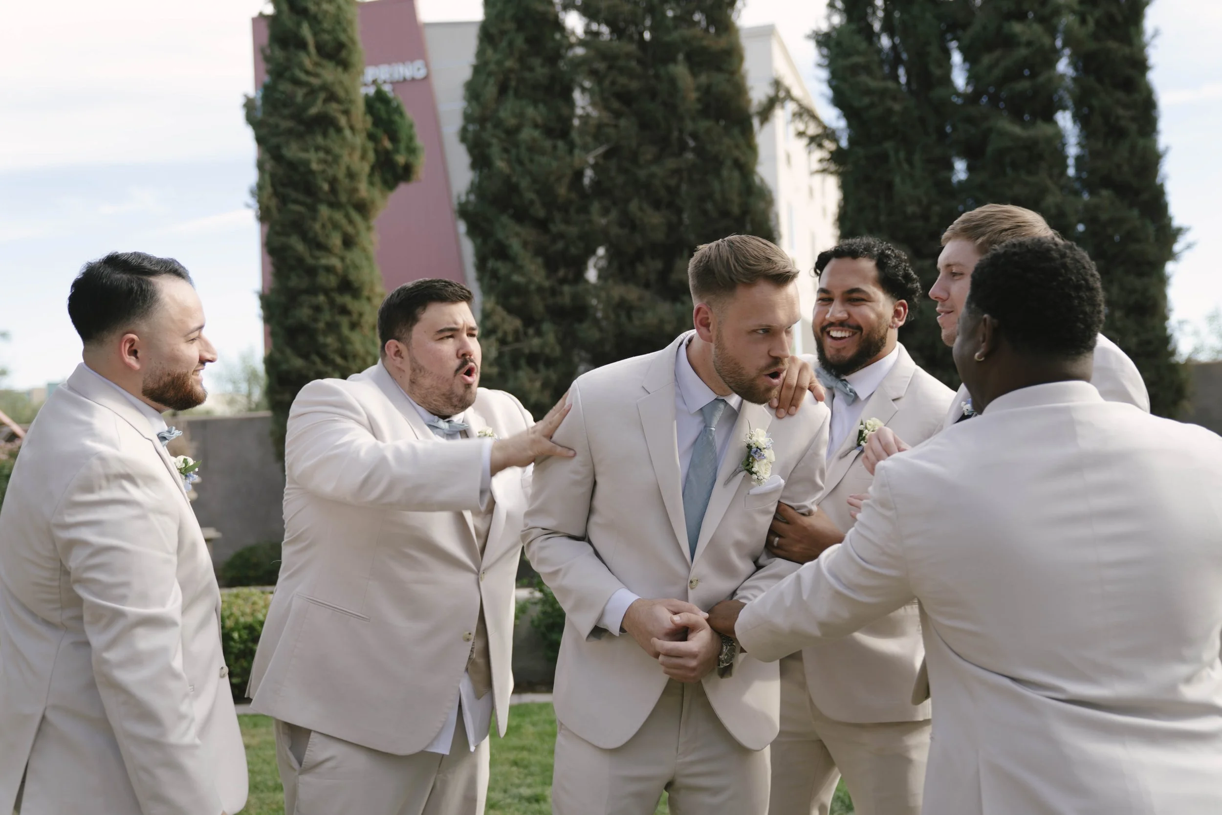 The bridal party portraits at Ashley Castle in Chandler, Arizona, brought playful energy and celebration to the day, with hybrid film and digital photography capturing candid laughter, stylish group moments, and unforgettable memories with the bride,