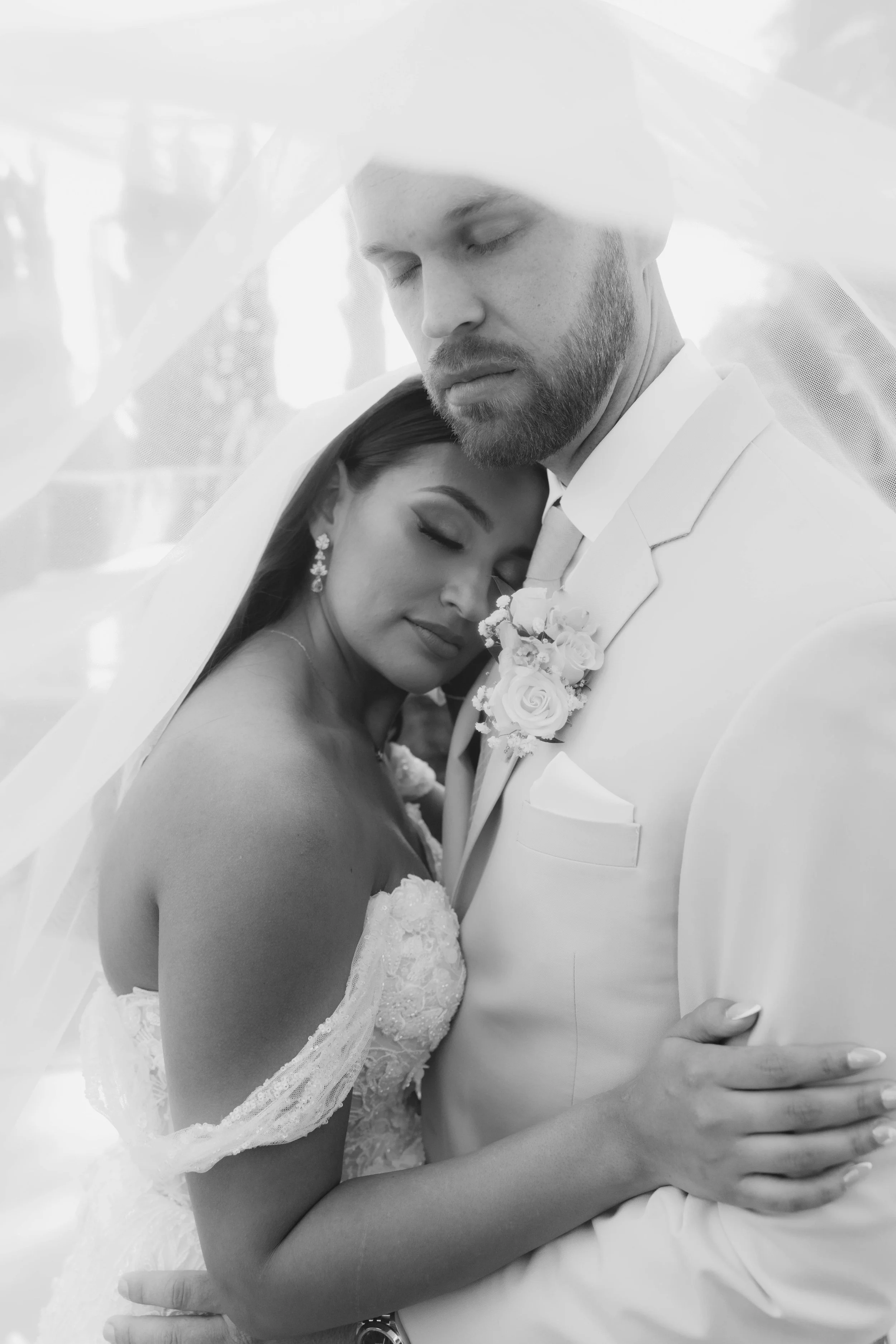 Romantic bride and groom portraits at Ashley Castle in Chandler, Arizona, captured through hybrid film and digital photography, showcase intimate newlywed moments filled with emotion, elegant garden backdrops, and timeless wedding-day connection.