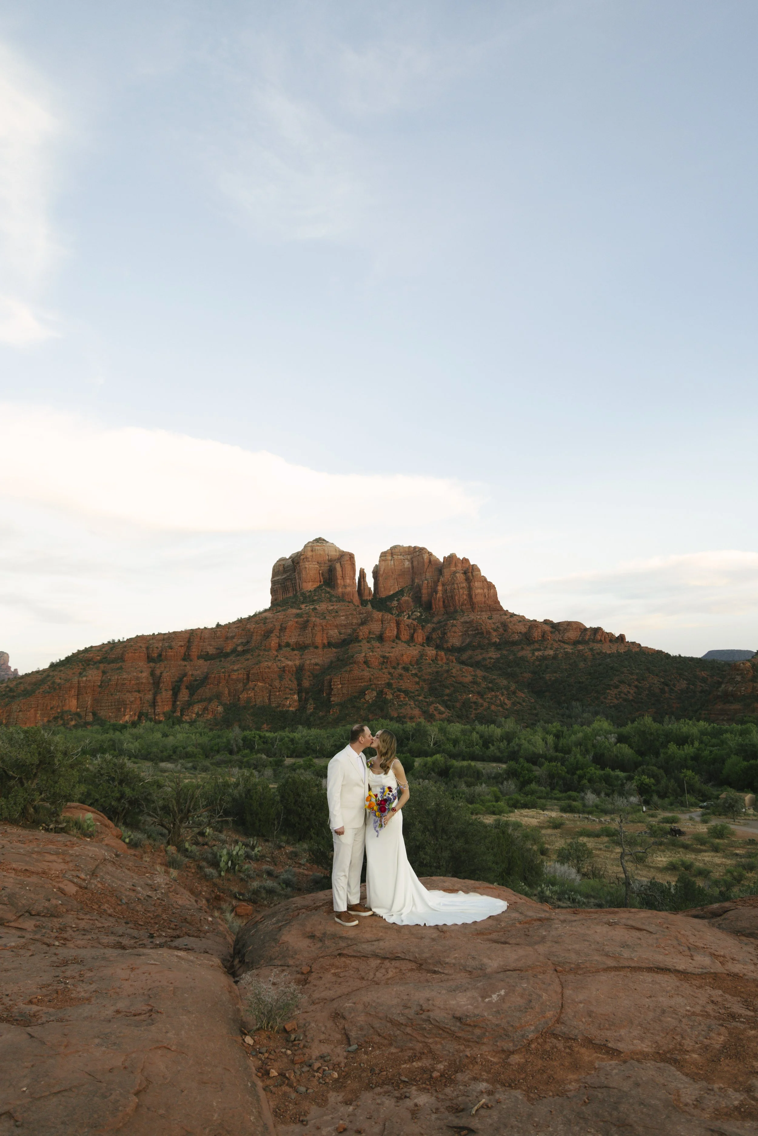 Romantic golden hour portraits at Secret Slick Rock during Chelsea and Travis' intimate Sedona elopement. Featuring Sedona's famous red rock views, stunning Arizona desert landscapes, and timeless wedding photography, these newlywed portraits perfect
