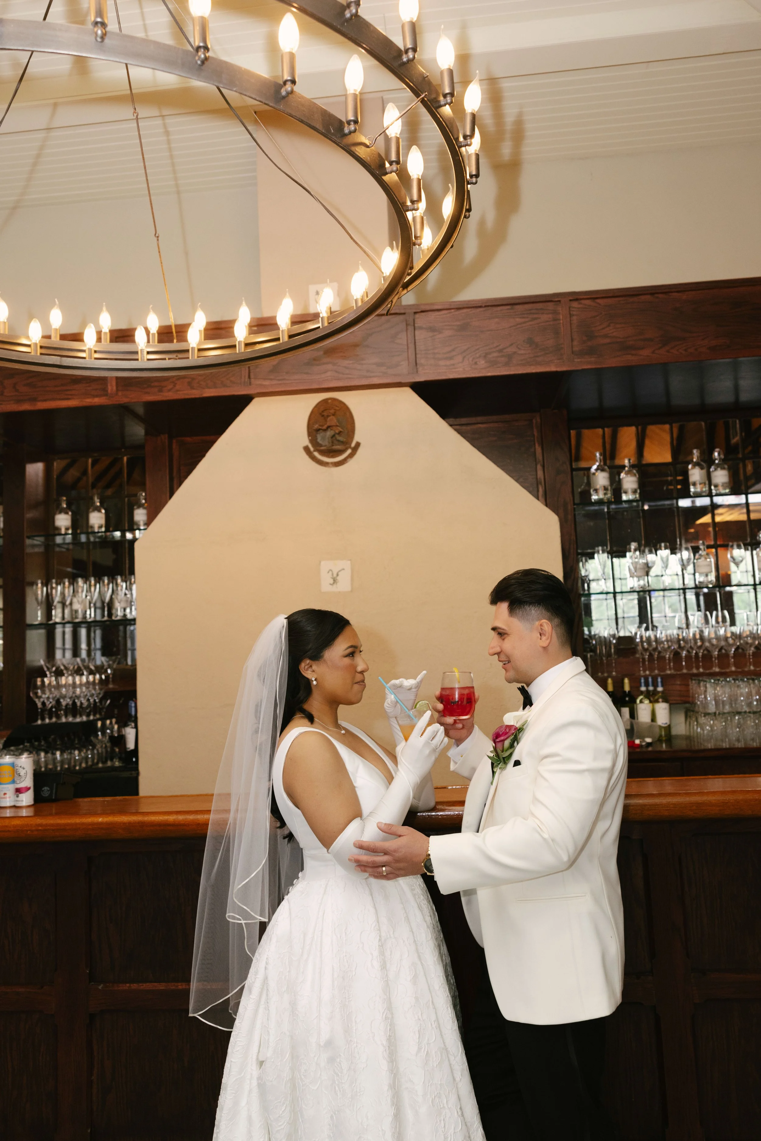 Bride and groom portraits at Hotel DuVillage showcase the venue's picturesque gardens, waterfront views, and timeless charm. Photographed on both digital and 35mm film, these wedding portraits focus on authentic connection, natural movement, and cand
