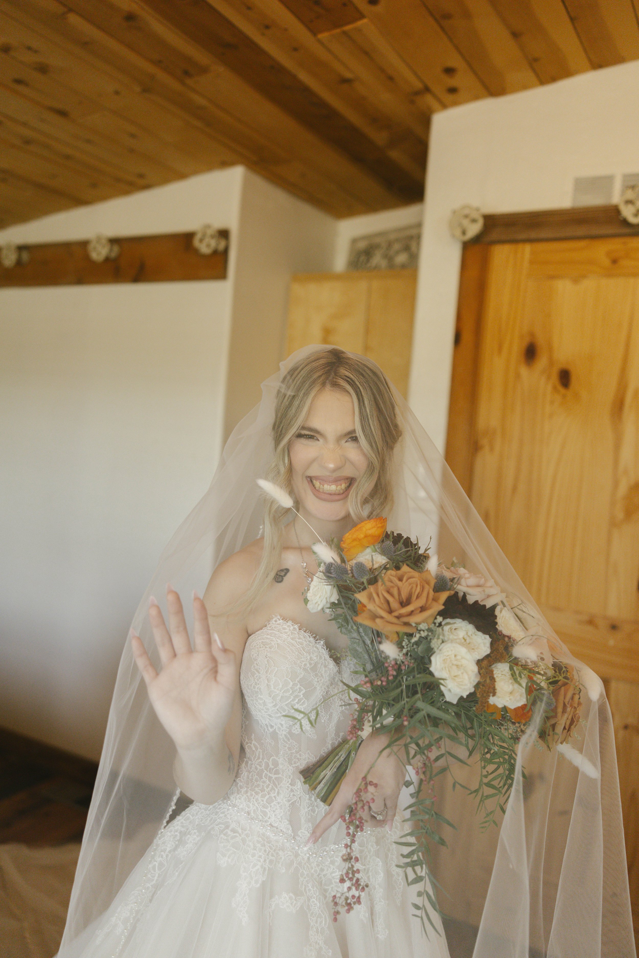 Documentary wedding photography at The Knotty Barn in Queen Creek, Arizona, captured by Arizona wedding photographer Raw By Laura, showcasing authentic moments, desert scenery, and a rustic western wedding setting.