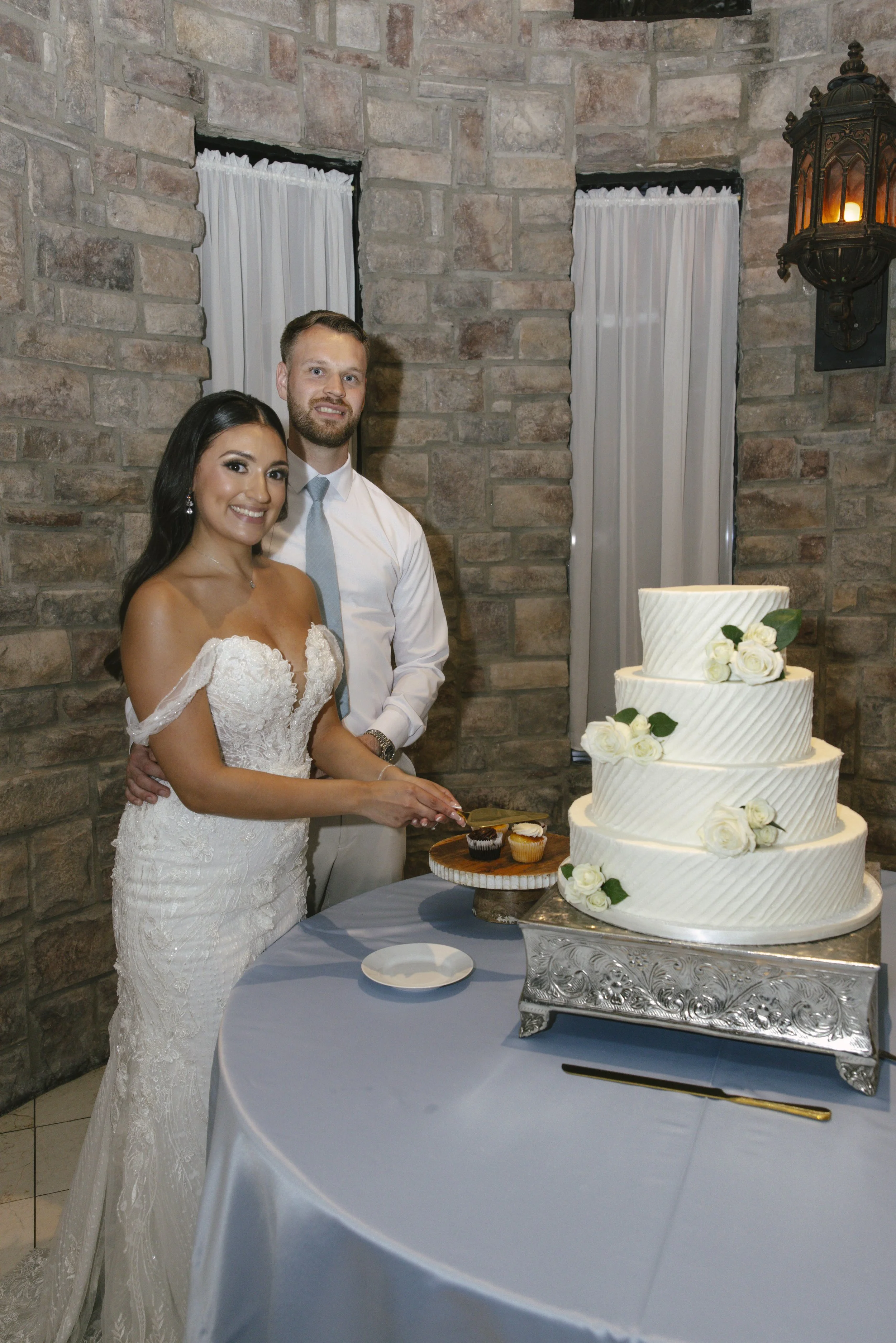 The reception celebration at Ashley Castle in Chandler, Arizona, came to life through hybrid film and digital photography, capturing elegant reception details, joyful bridal party entrances, and lively dance floor moments inside the castle’s grand ba