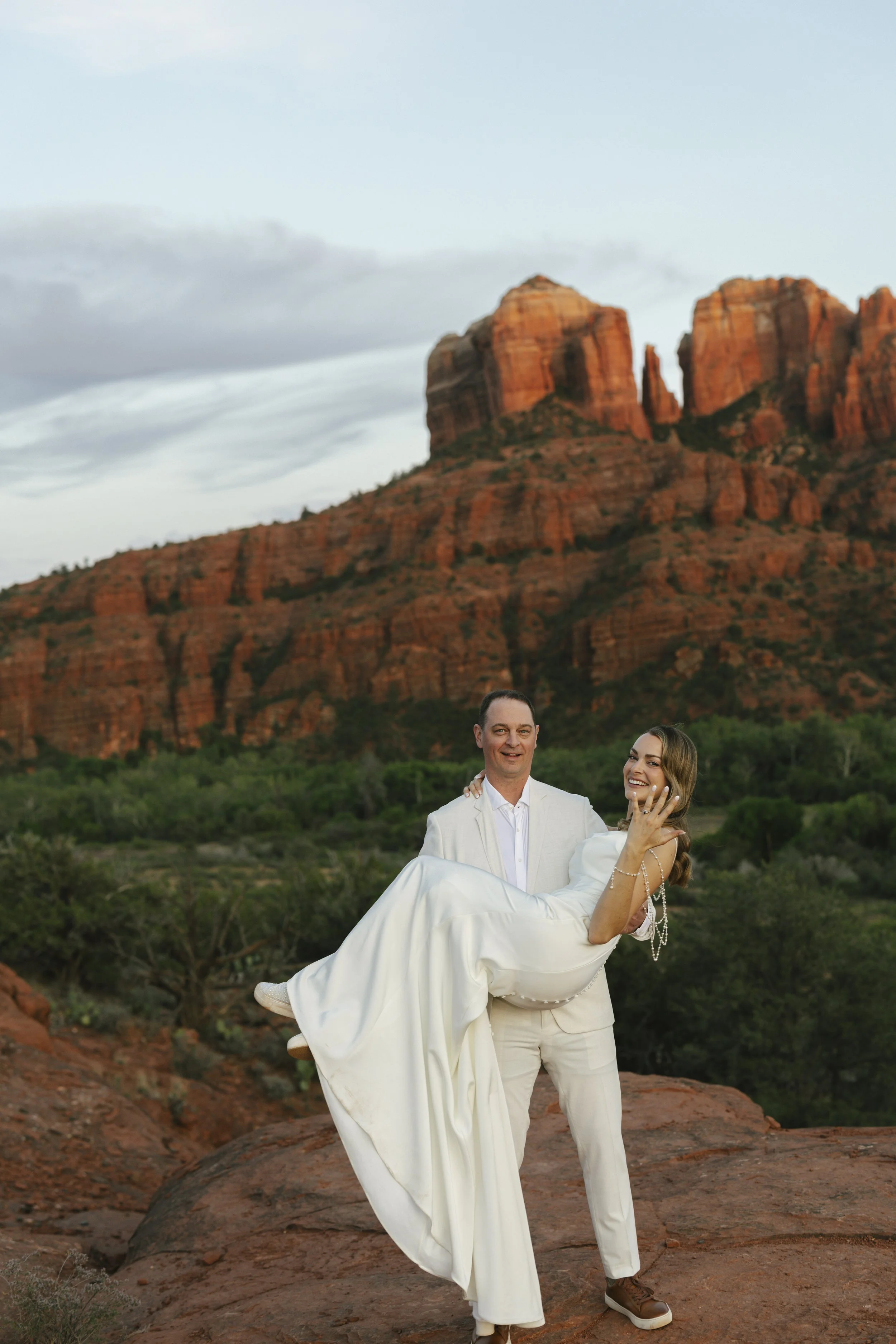 Romantic golden hour portraits at Secret Slick Rock during Chelsea and Travis' intimate Sedona elopement. Featuring Sedona's famous red rock views, stunning Arizona desert landscapes, and timeless wedding photography, these newlywed portraits perfect