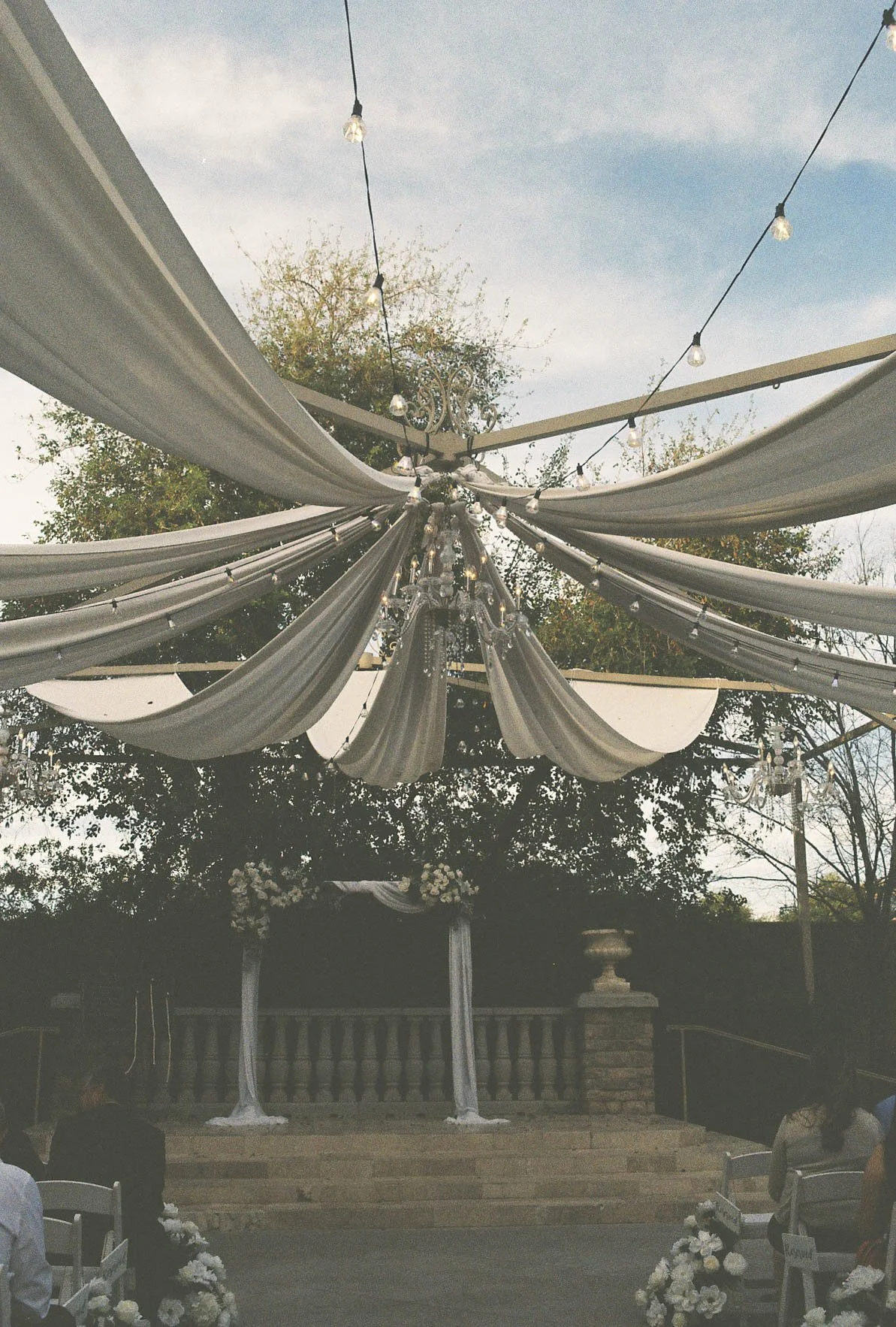 Elegant wedding details from the bride and groom’s Ashley Castle wedding in Chandler, Arizona, featuring romantic ceremony décor, personalized memorial touches, and timeless reception styling at one of Arizona’s premier luxury wedding venues.