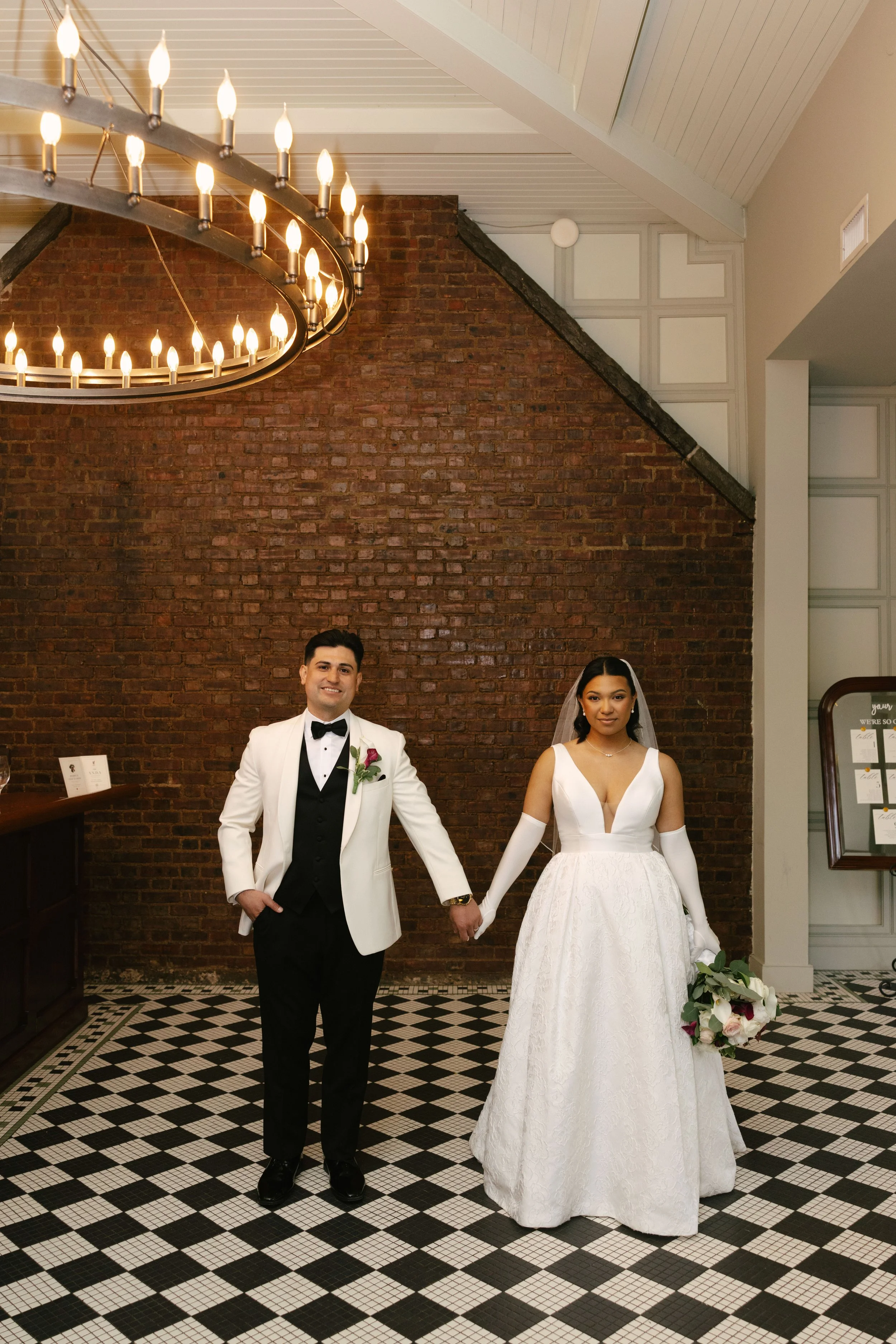 Bride and groom portraits at Hotel DuVillage showcase the venue's picturesque gardens, waterfront views, and timeless charm. Photographed on both digital and 35mm film, these wedding portraits focus on authentic connection, natural movement, and cand