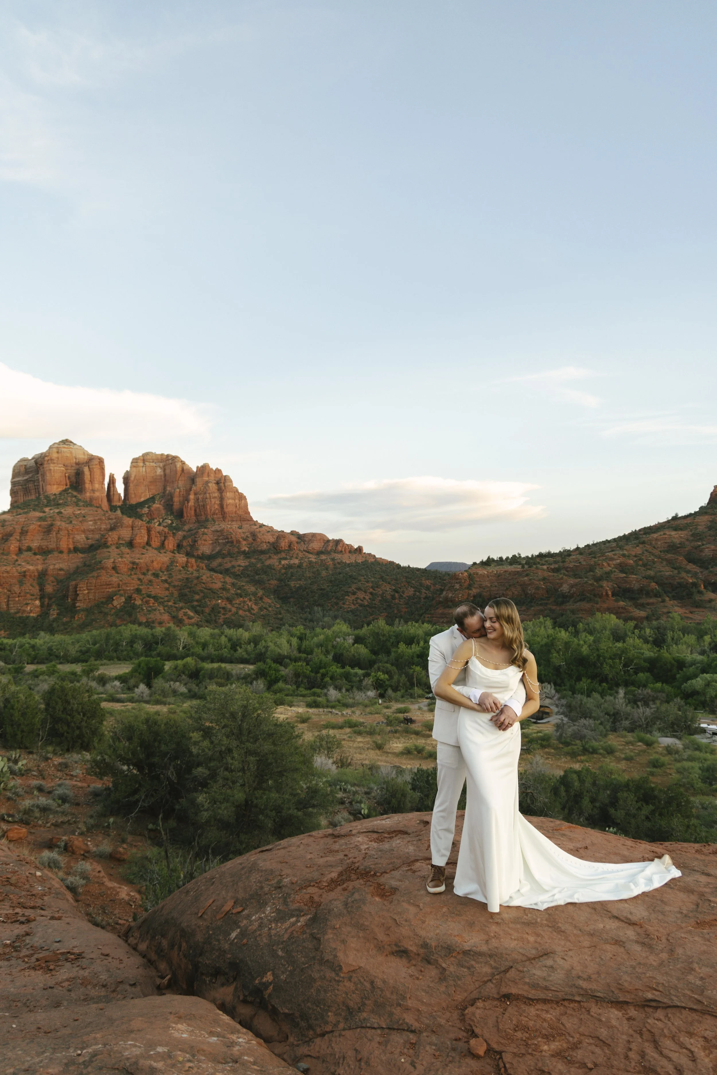 Romantic golden hour portraits at Secret Slick Rock during Chelsea and Travis' intimate Sedona elopement. Featuring Sedona's famous red rock views, stunning Arizona desert landscapes, and timeless wedding photography, these newlywed portraits perfect