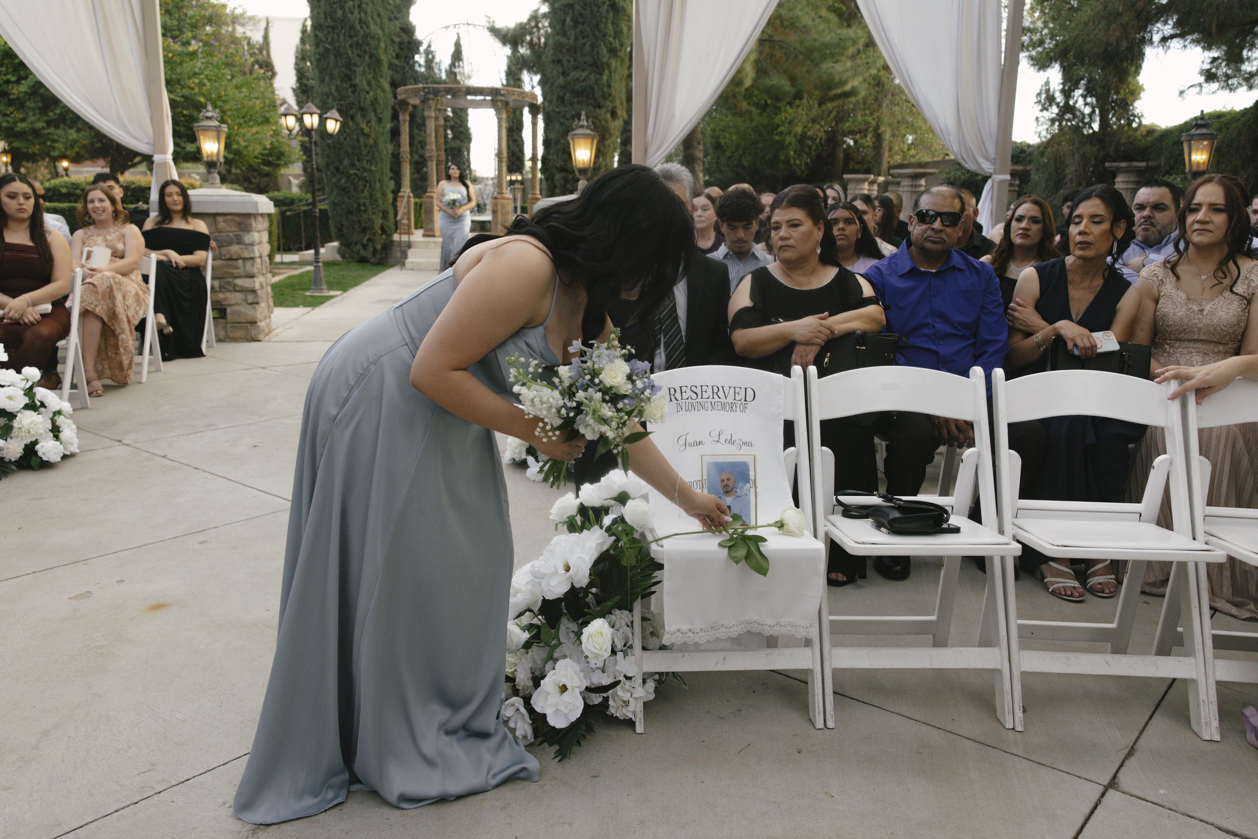 The wedding processional at Ashley Castle in Chandler, Arizona, was captured through hybrid film and digital photography, preserving the graceful entrances of the bridal party as they made their way through the romantic outdoor ceremony space surroun