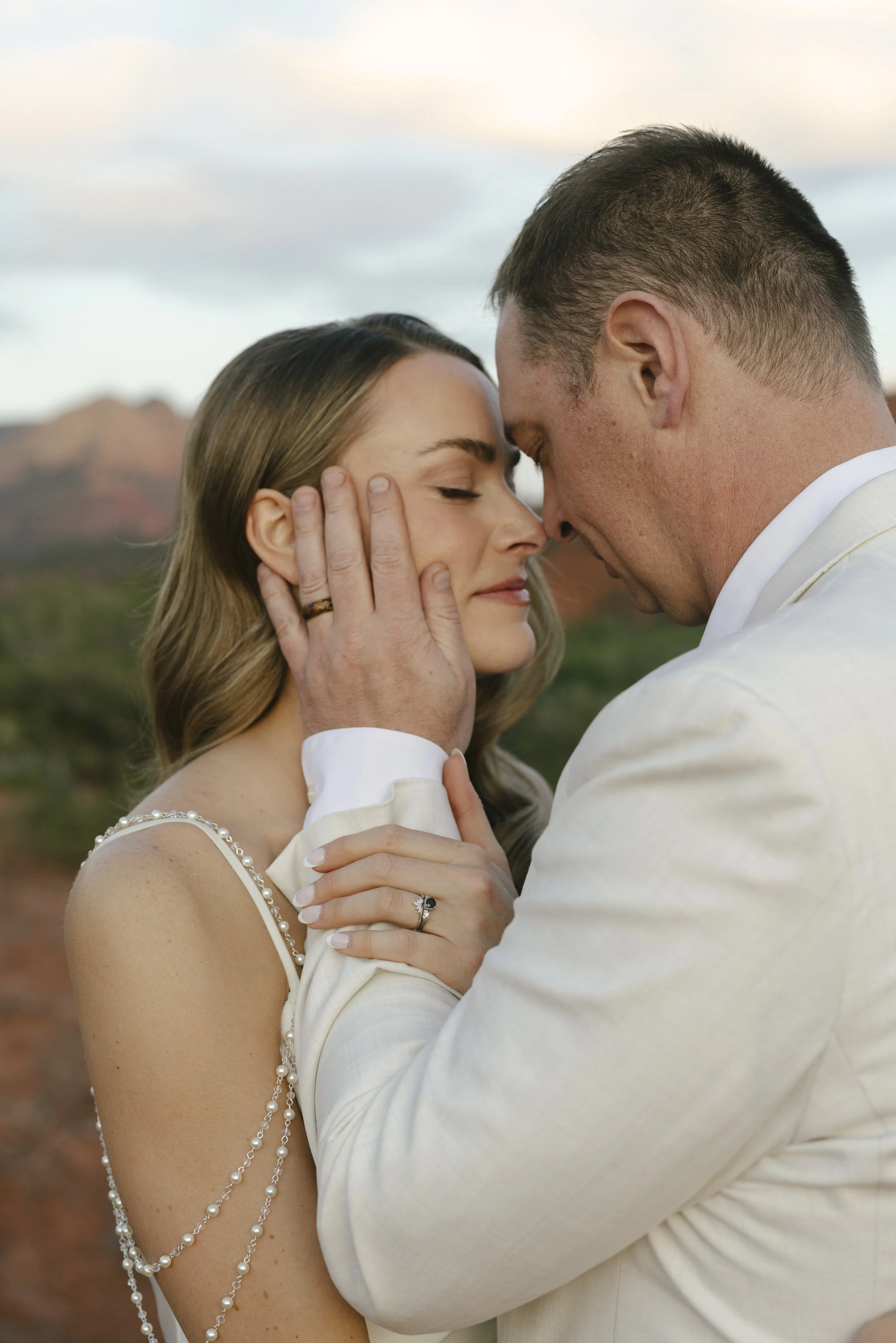 Romantic golden hour portraits at Secret Slick Rock during Chelsea and Travis' intimate Sedona elopement. Featuring Sedona's famous red rock views, stunning Arizona desert landscapes, and timeless wedding photography, these newlywed portraits perfect