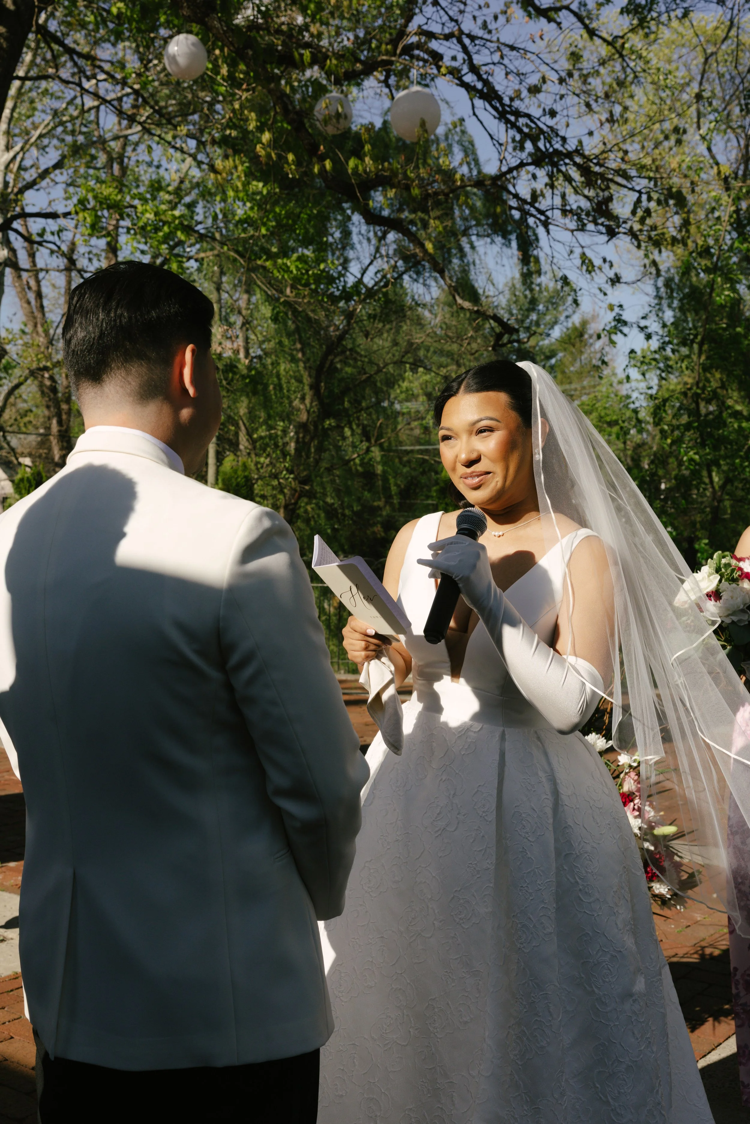 Outdoor wedding ceremony at Hotel DuVillage featuring the bride and groom, wedding party, and meaningful moments captured on both digital and 35mm film. A timeless celebration documented with a candid, documentary approach