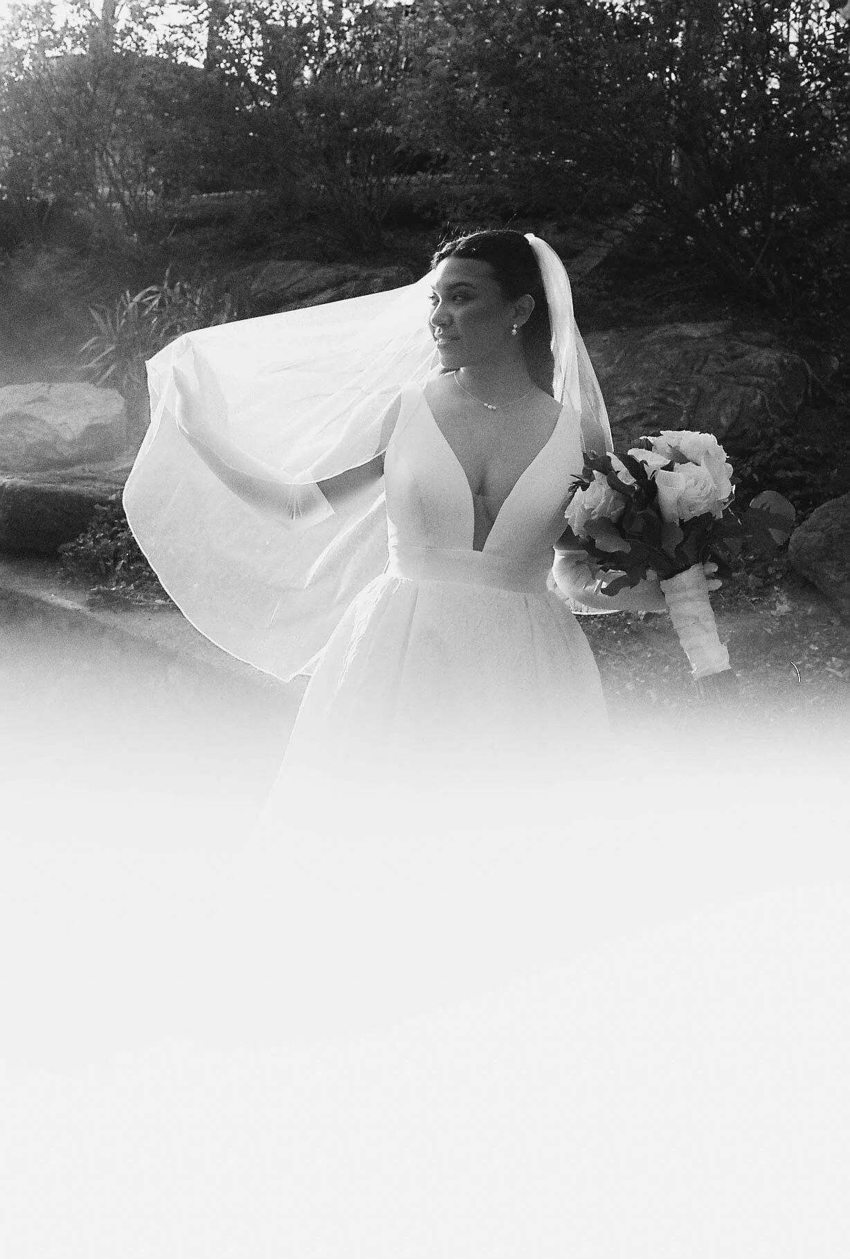 Bride and groom portraits at Hotel DuVillage showcase the venue's picturesque gardens, waterfront views, and timeless charm. Photographed on both digital and 35mm film, these wedding portraits focus on authentic connection, natural movement, and cand