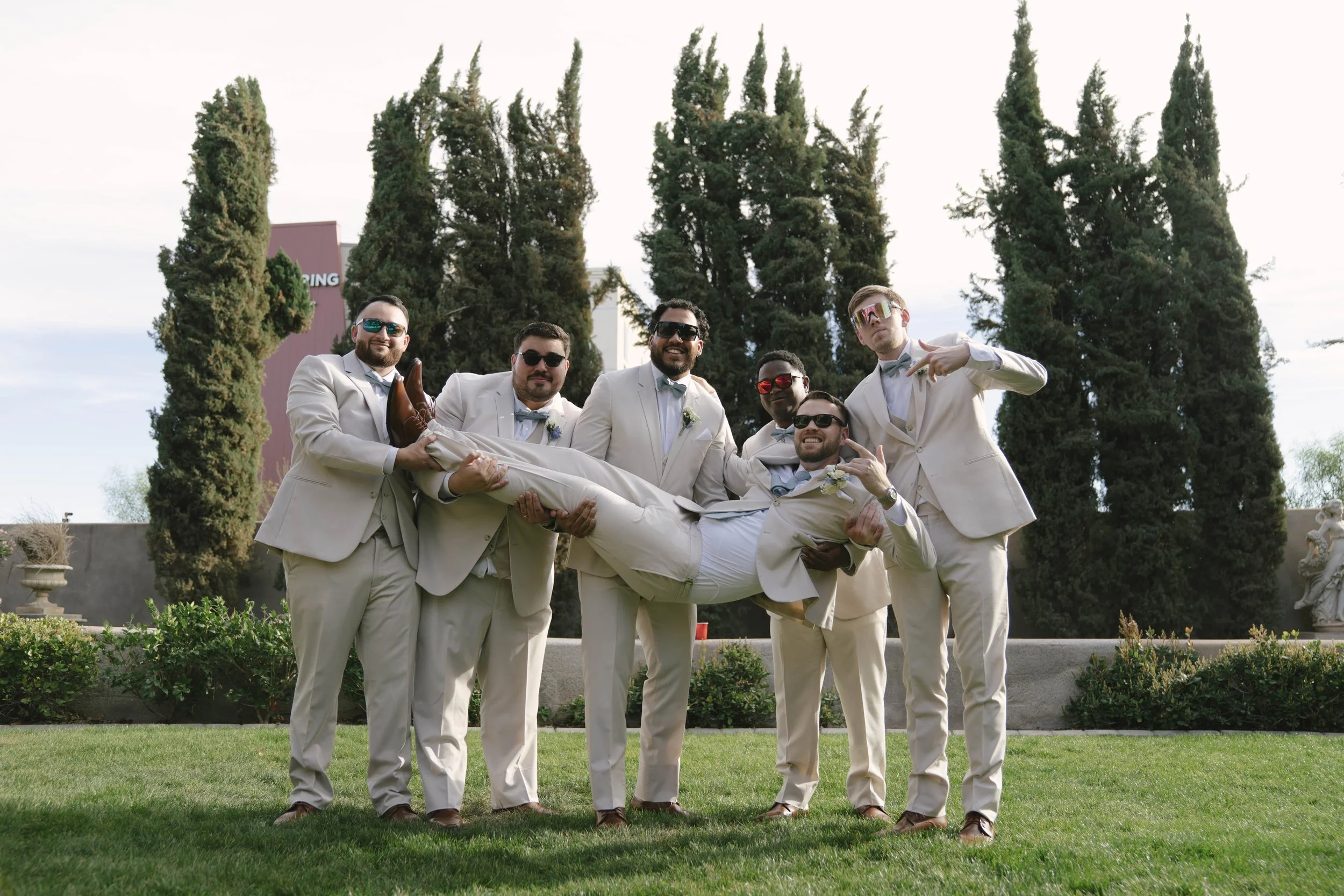 The bridal party portraits at Ashley Castle in Chandler, Arizona, brought playful energy and celebration to the day, with hybrid film and digital photography capturing candid laughter, stylish group moments, and unforgettable memories with the bride,