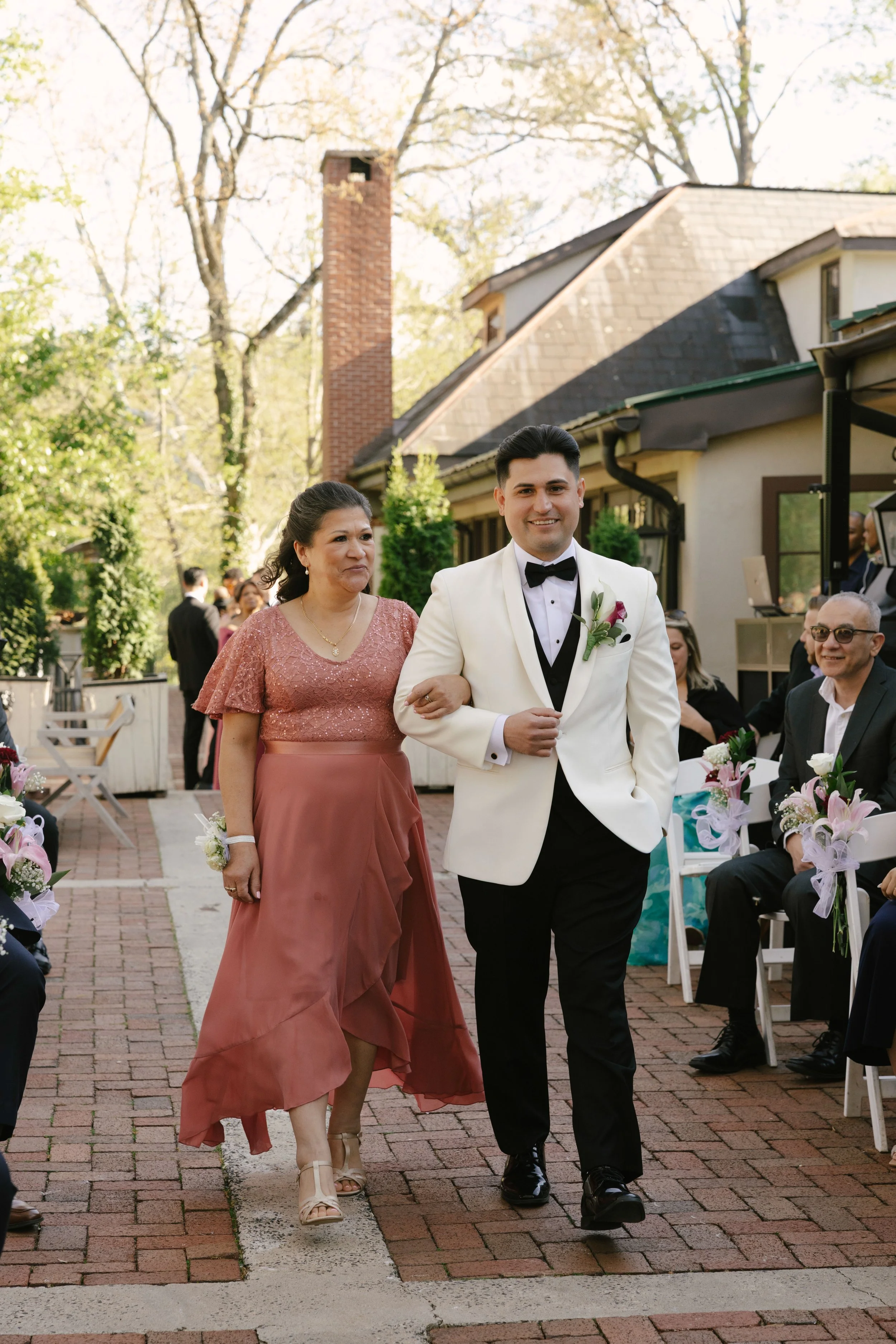 Outdoor wedding ceremony at Hotel DuVillage featuring the bride and groom, wedding party, and meaningful moments captured on both digital and 35mm film. A timeless celebration documented with a candid, documentary approach