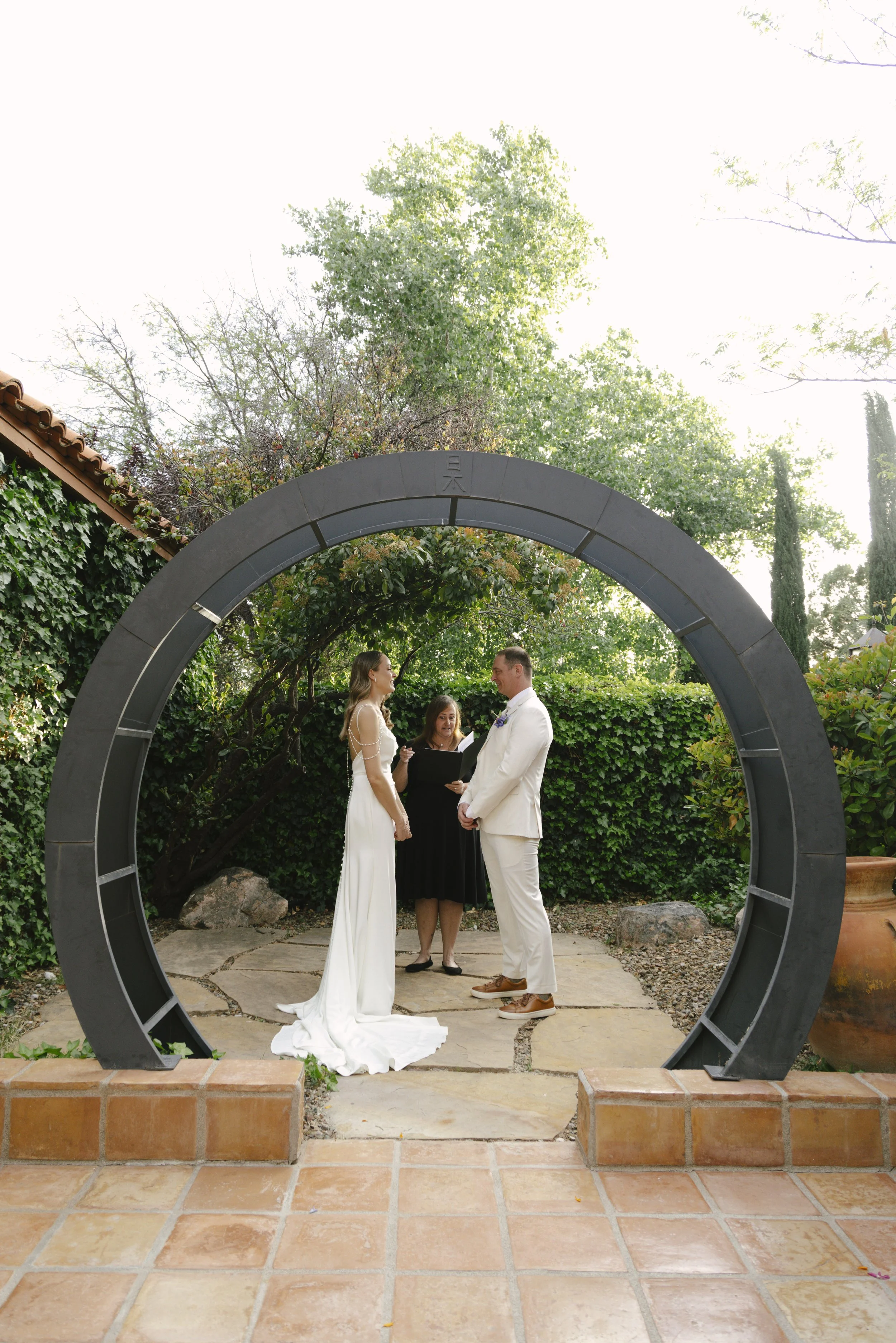 Chelsea and Travis exchanged heartfelt vows during their intimate Sedona elopement at a private Arizona home, surrounded by their closest family, friends, and beloved dog. Their outdoor ceremony was filled with meaningful moments, personal vows, and 