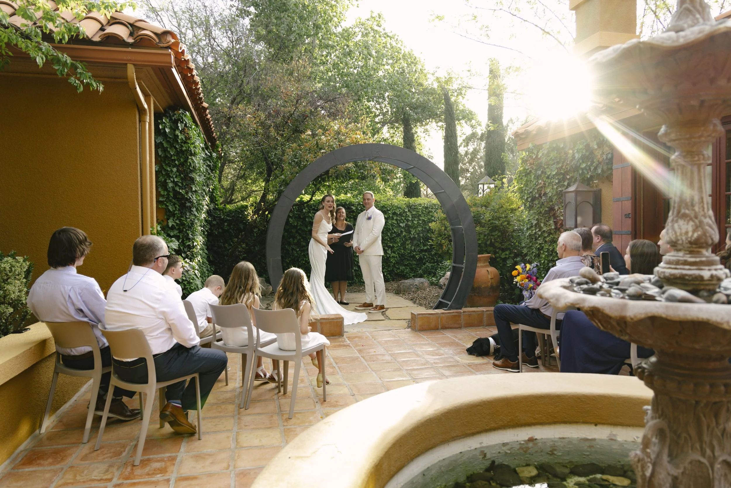 Chelsea and Travis exchanged heartfelt vows during their intimate Sedona elopement at a private Arizona home, surrounded by their closest family, friends, and beloved dog. Their outdoor ceremony was filled with meaningful moments, personal vows, and 