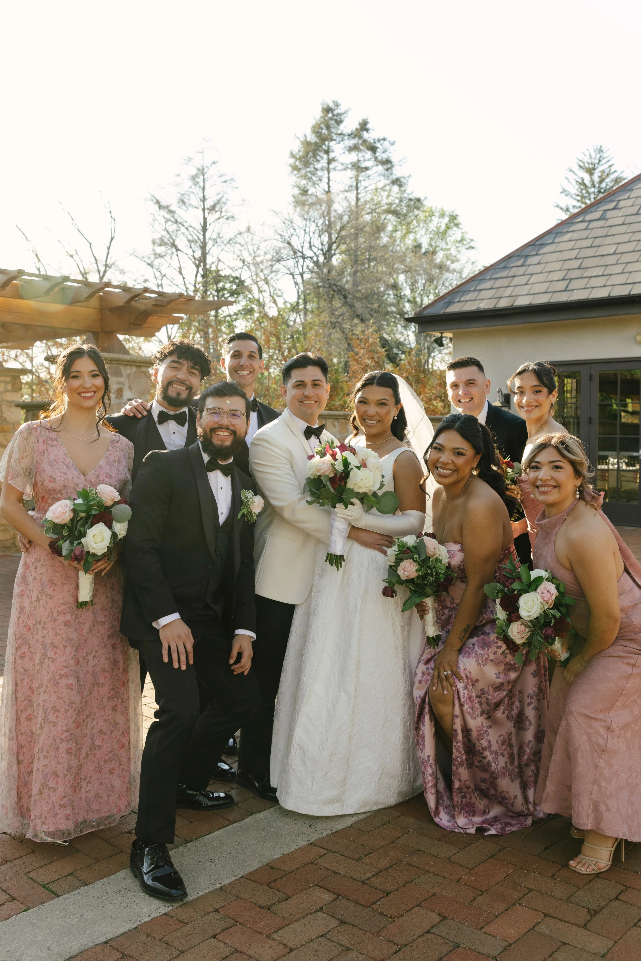 Bridal party portraits at Hotel DuVillage celebrate the bride and groom alongside their closest friends and family. Captured on digital and 35mm film, these images highlight genuine laughter, timeless portraits, and unforgettable moments.
