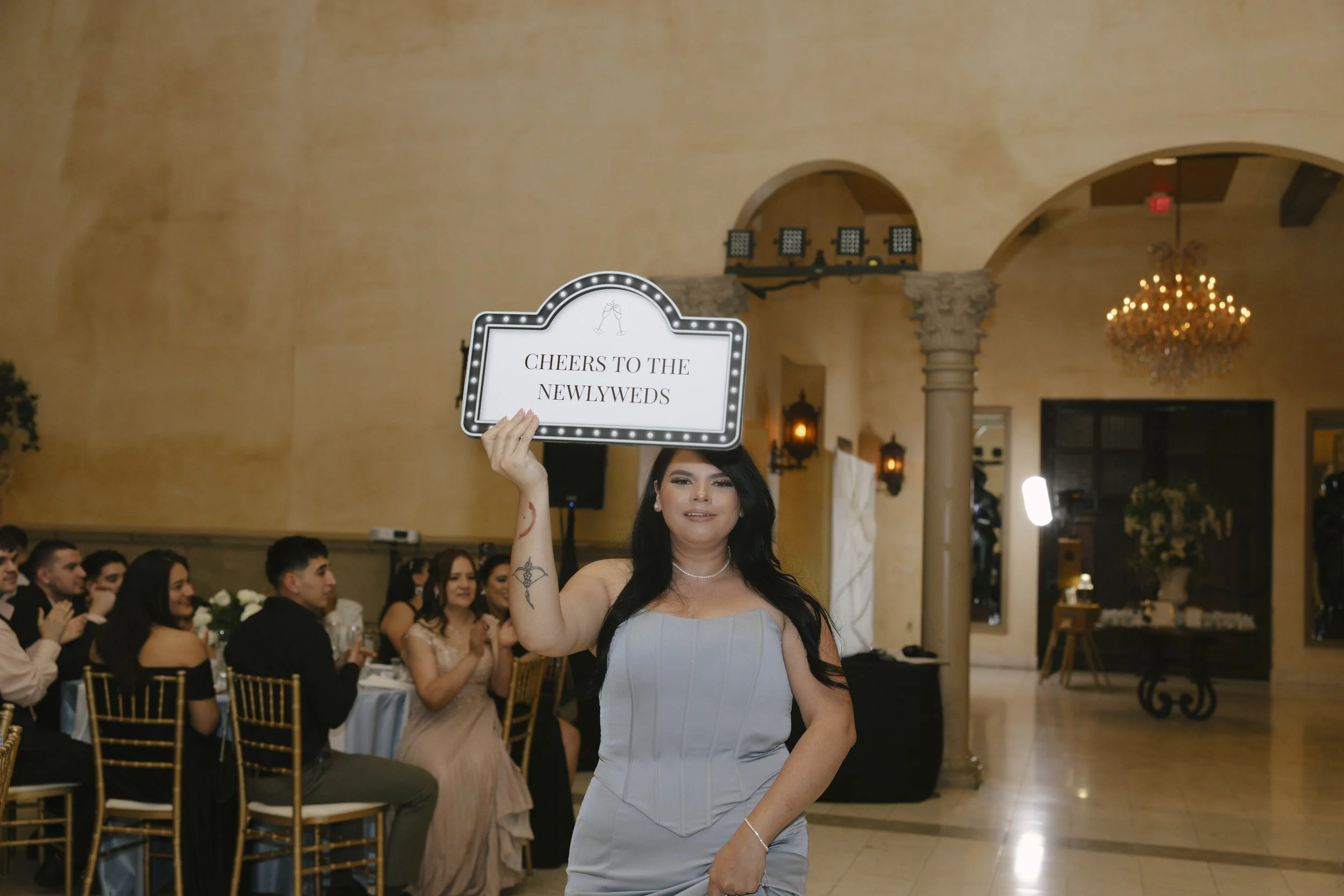 The reception celebration at Ashley Castle in Chandler, Arizona, came to life through hybrid film and digital photography, capturing elegant reception details, joyful bridal party entrances, and lively dance floor moments inside the castle’s grand ba