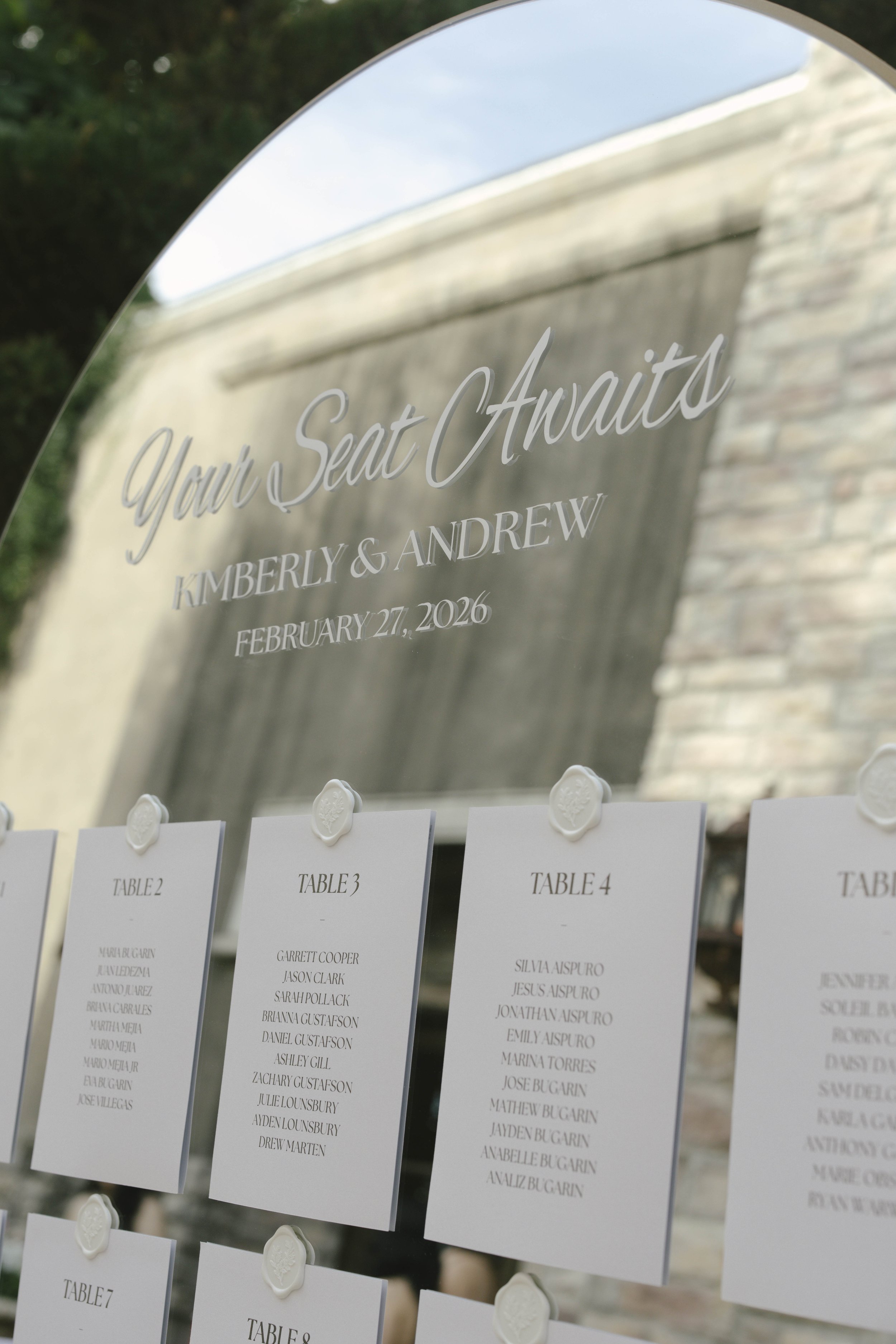 Ceremony details at Ashley Castle in Chandler, Arizona, were thoughtfully captured through hybrid film and digital photography, highlighting elegant signage, romantic seating displays, and the bridesmaid processional as guests gathered for this timel