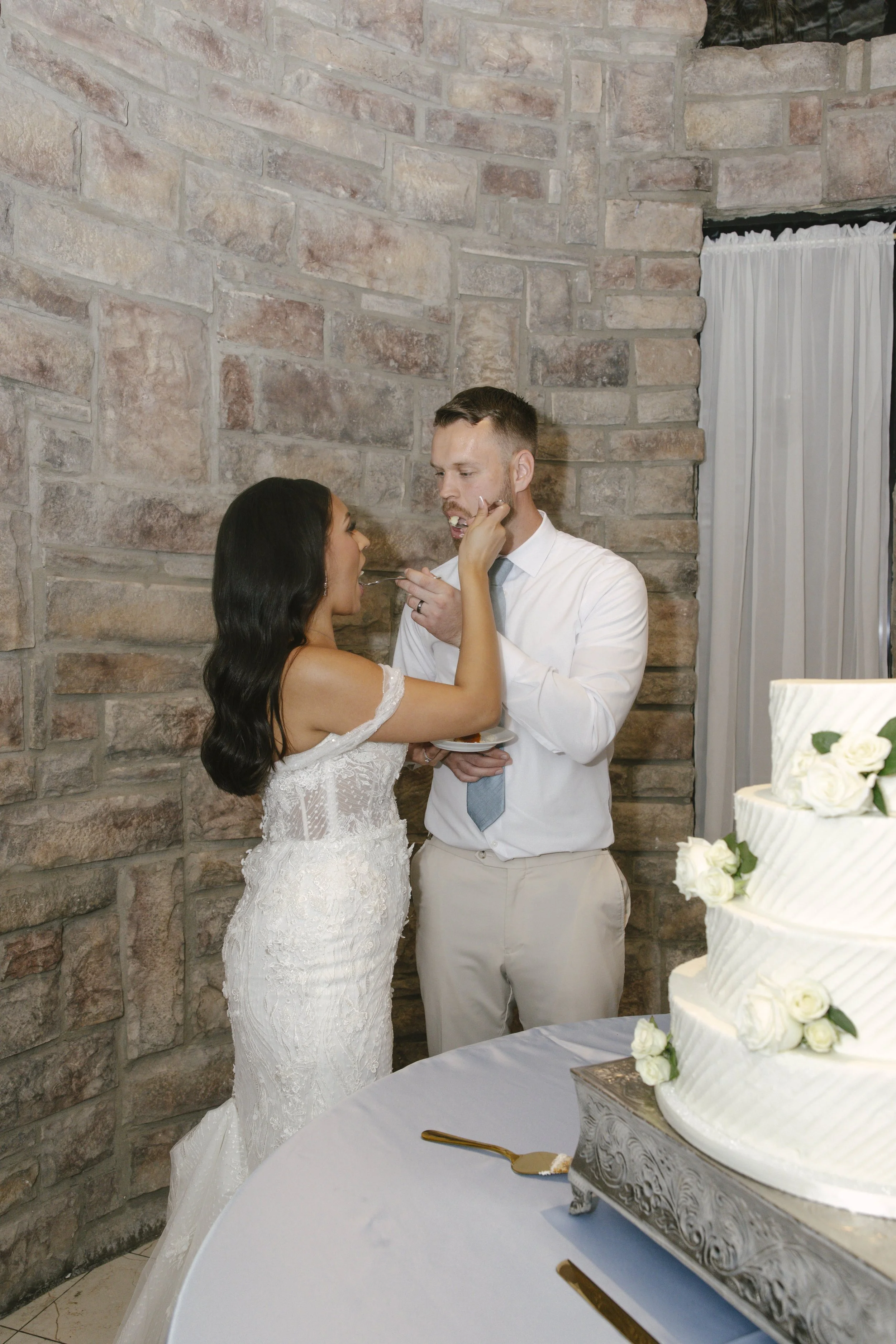 The reception celebration at Ashley Castle in Chandler, Arizona, came to life through hybrid film and digital photography, capturing elegant reception details, joyful bridal party entrances, and lively dance floor moments inside the castle’s grand ba