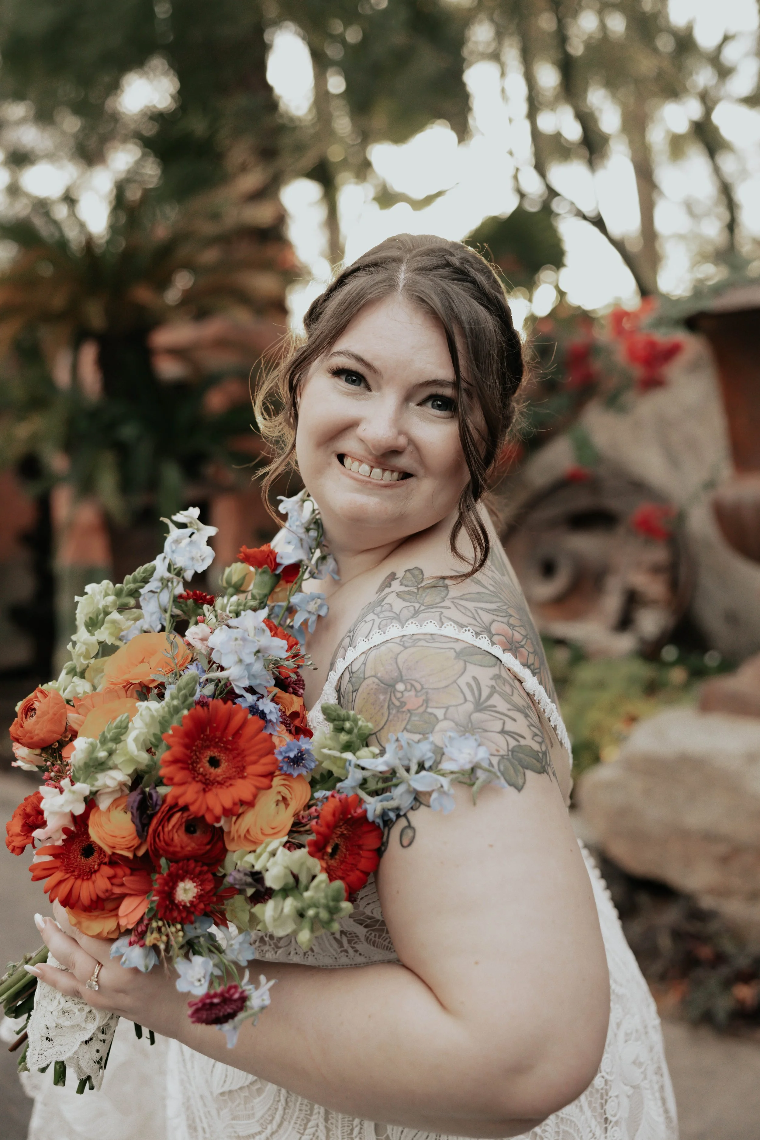After the ceremony, Lauren and Joel explored the beautiful garden paths and adobe architecture of the Boojum Tree for their wedding portraits. Surrounded by desert greenery and warm Phoenix light, these moments captured the joy and excitement of thei
