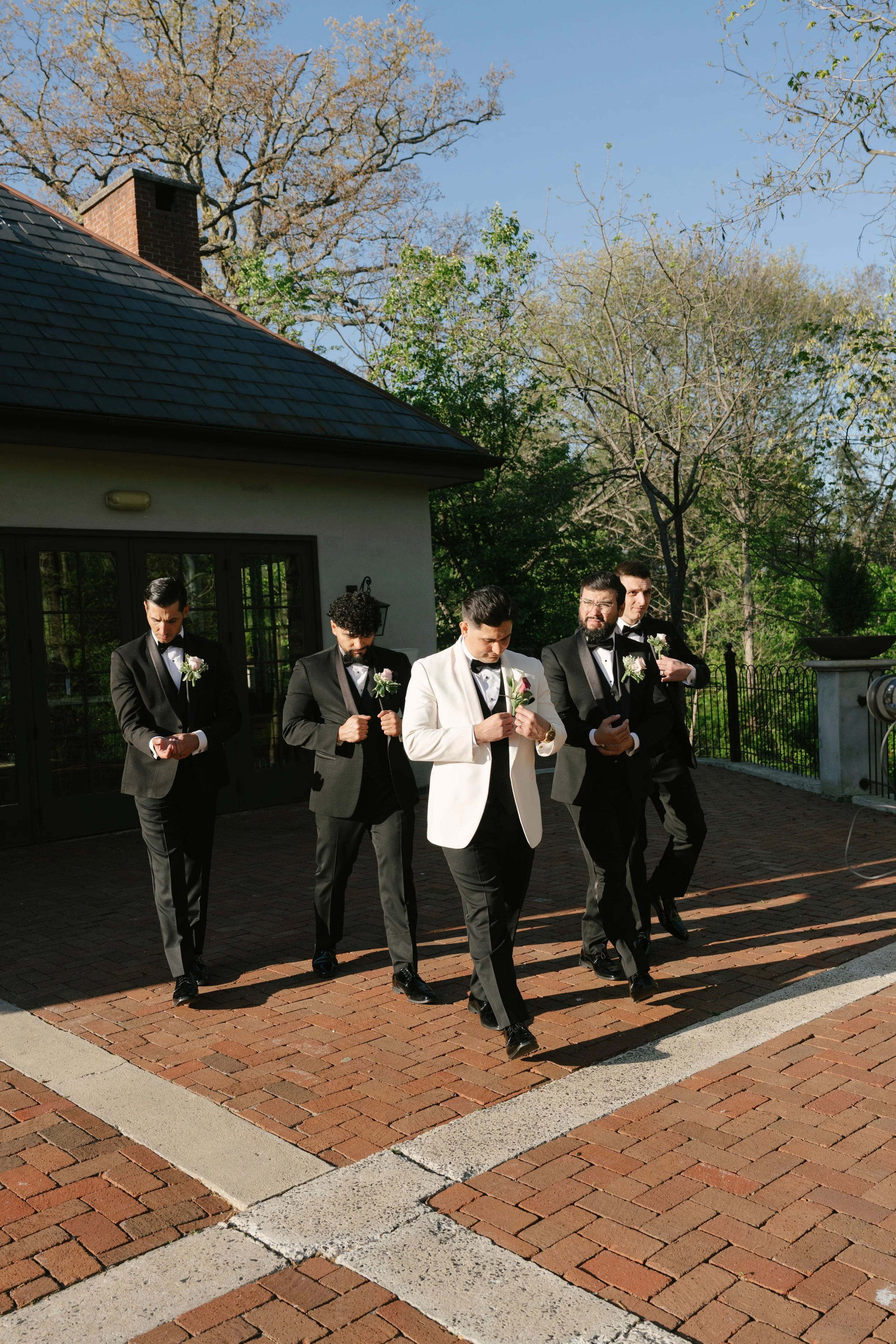 Bridal party portraits at Hotel DuVillage celebrate the bride and groom alongside their closest friends and family. Captured on digital and 35mm film, these images highlight genuine laughter, timeless portraits, and unforgettable moments.