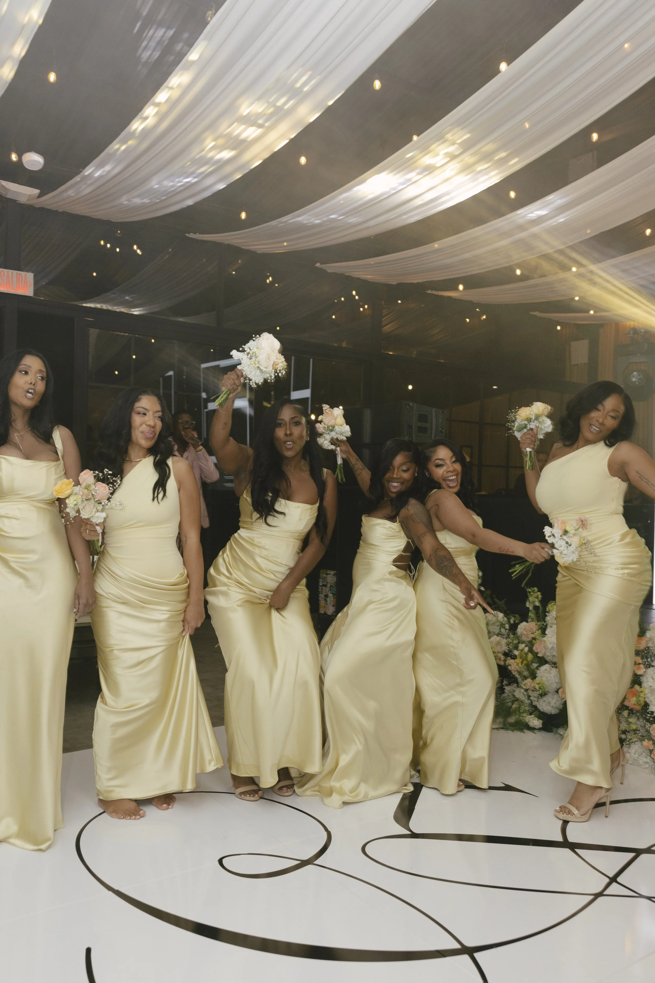 Wedding reception details at Forest Campestre in Medellín, Colombia featuring elegant reception décor, floral tablescapes, wedding cake, custom signage, first dance, and lively celebration captured through documentary wedding photography