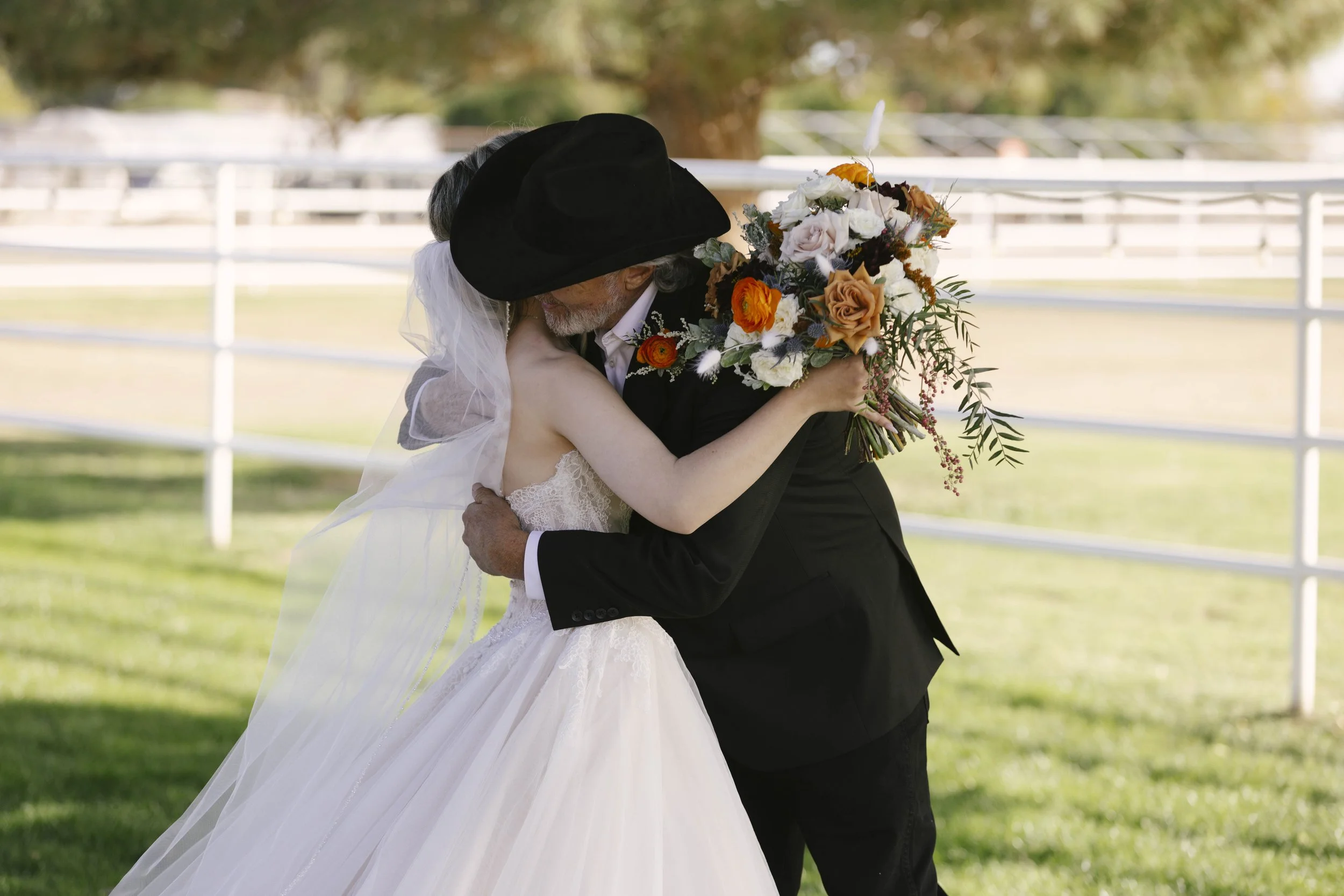 Candid wedding photography from a December wedding at The Knotty Barn in Queen Creek, Arizona, photographed by Raw By Laura, highlighting natural emotion, rustic details, and warm desert tones.