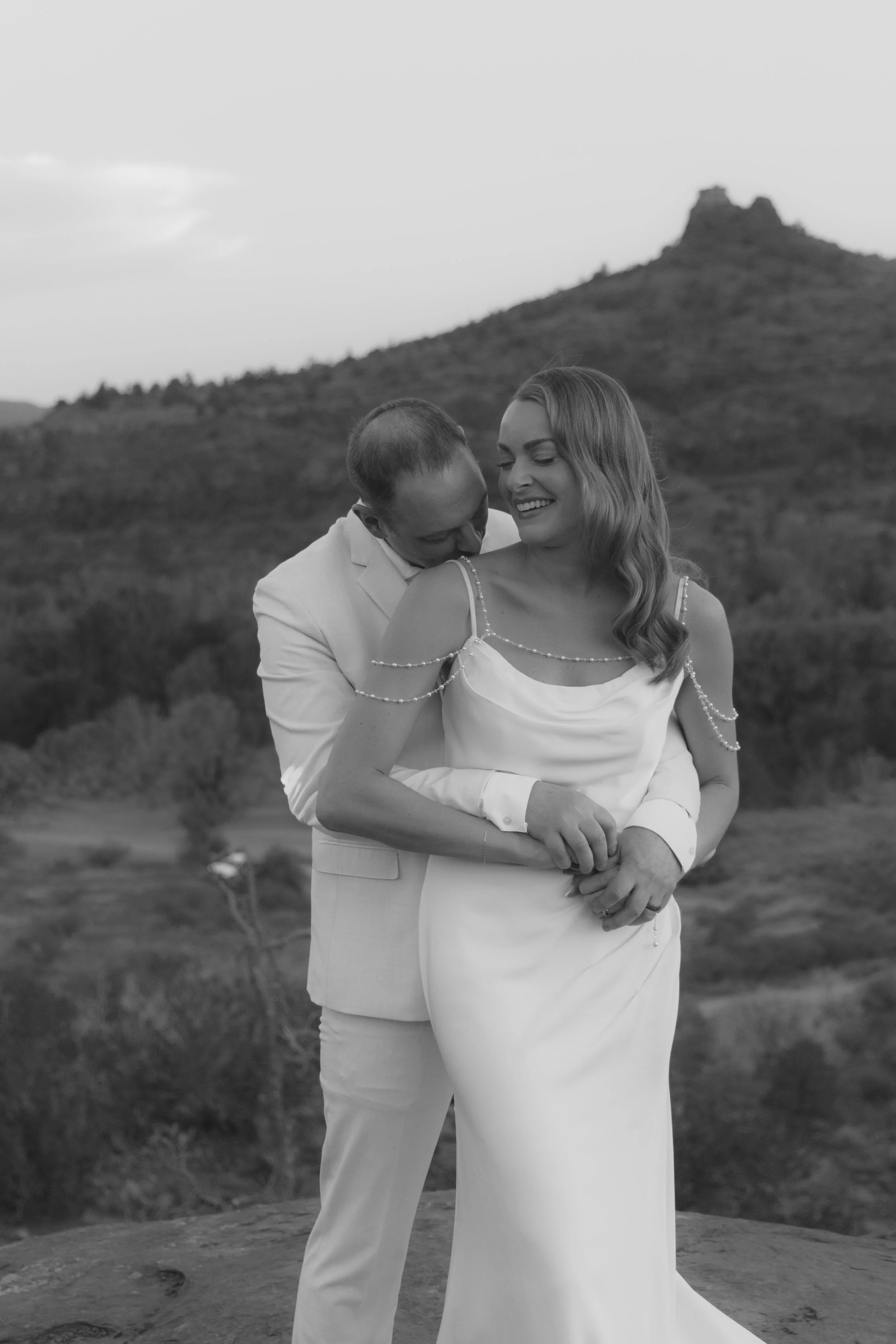 Romantic golden hour portraits at Secret Slick Rock during Chelsea and Travis' intimate Sedona elopement. Featuring Sedona's famous red rock views, stunning Arizona desert landscapes, and timeless wedding photography, these newlywed portraits perfect