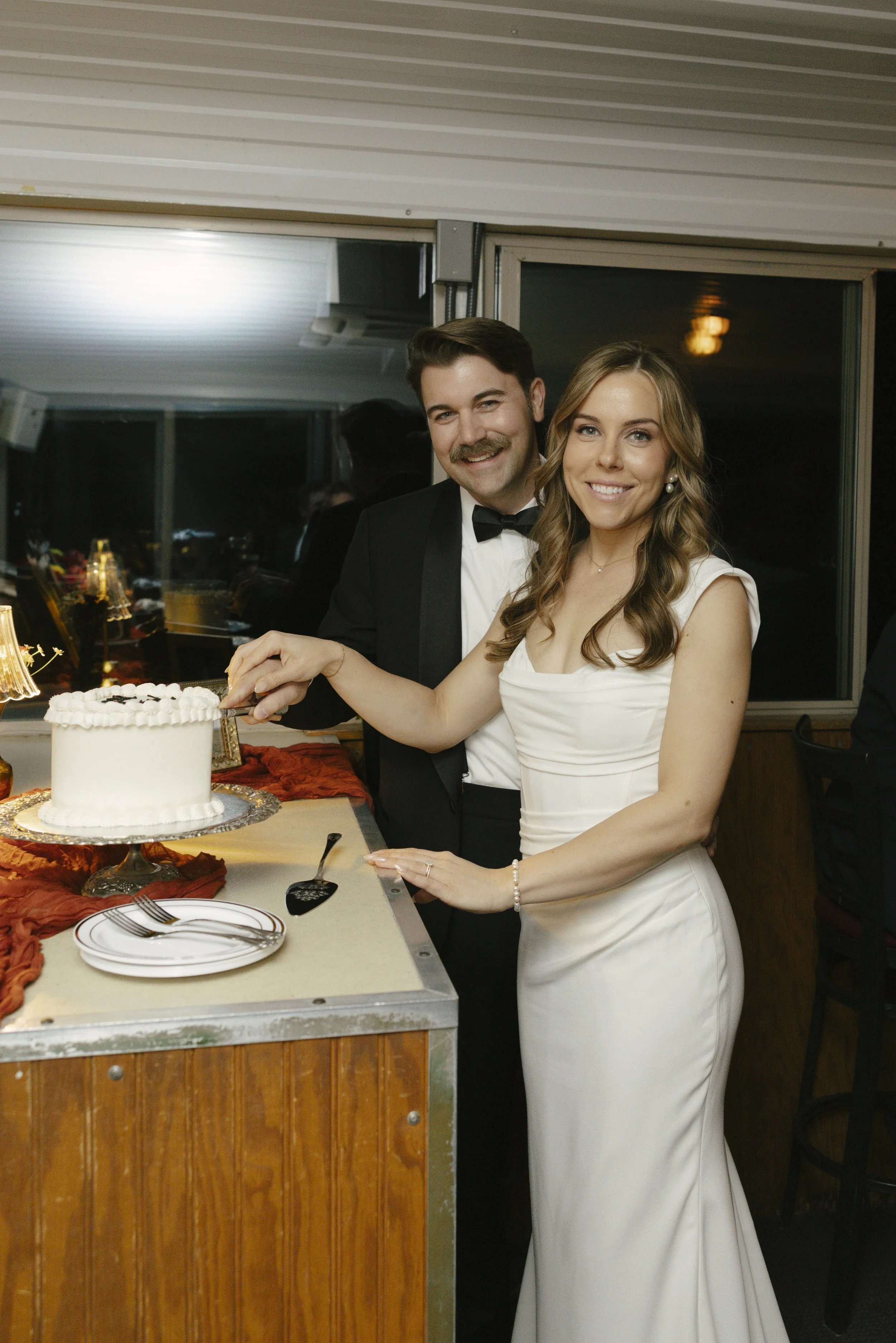 To close out the evening aboard the Dolly Steamboat, the couple shared their cake cutting surrounded by family and friends. It was a sweet and joyful moment that wrapped up their Canyon Lake wedding celebration with laughter, love, and one last toast