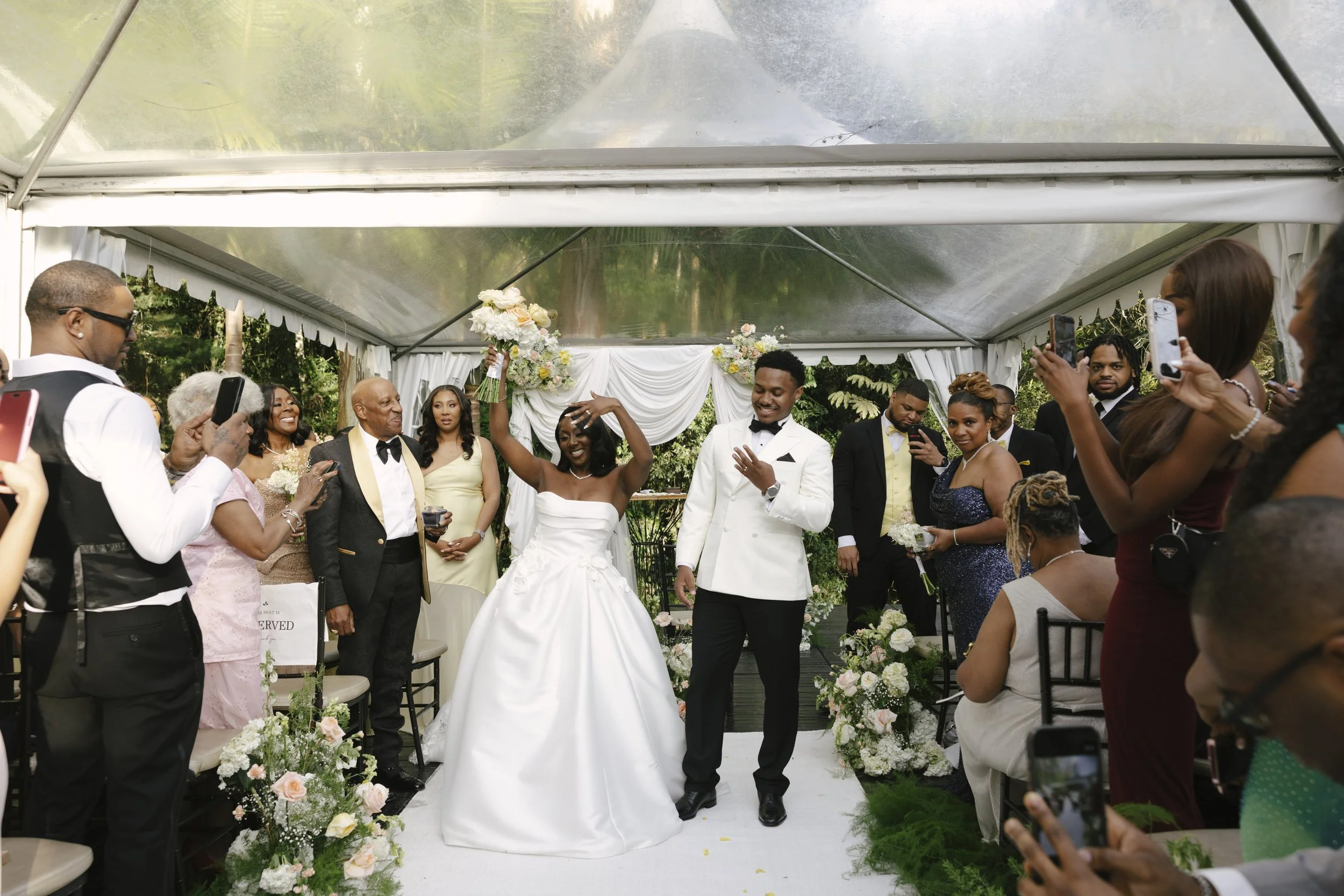 Forest Campestre wedding ceremony in Medellín, Colombia featuring the bridal processional, groom's reaction, emotional ceremony moments, floral aisle design, wedding guests, and documentary-style wedding photography