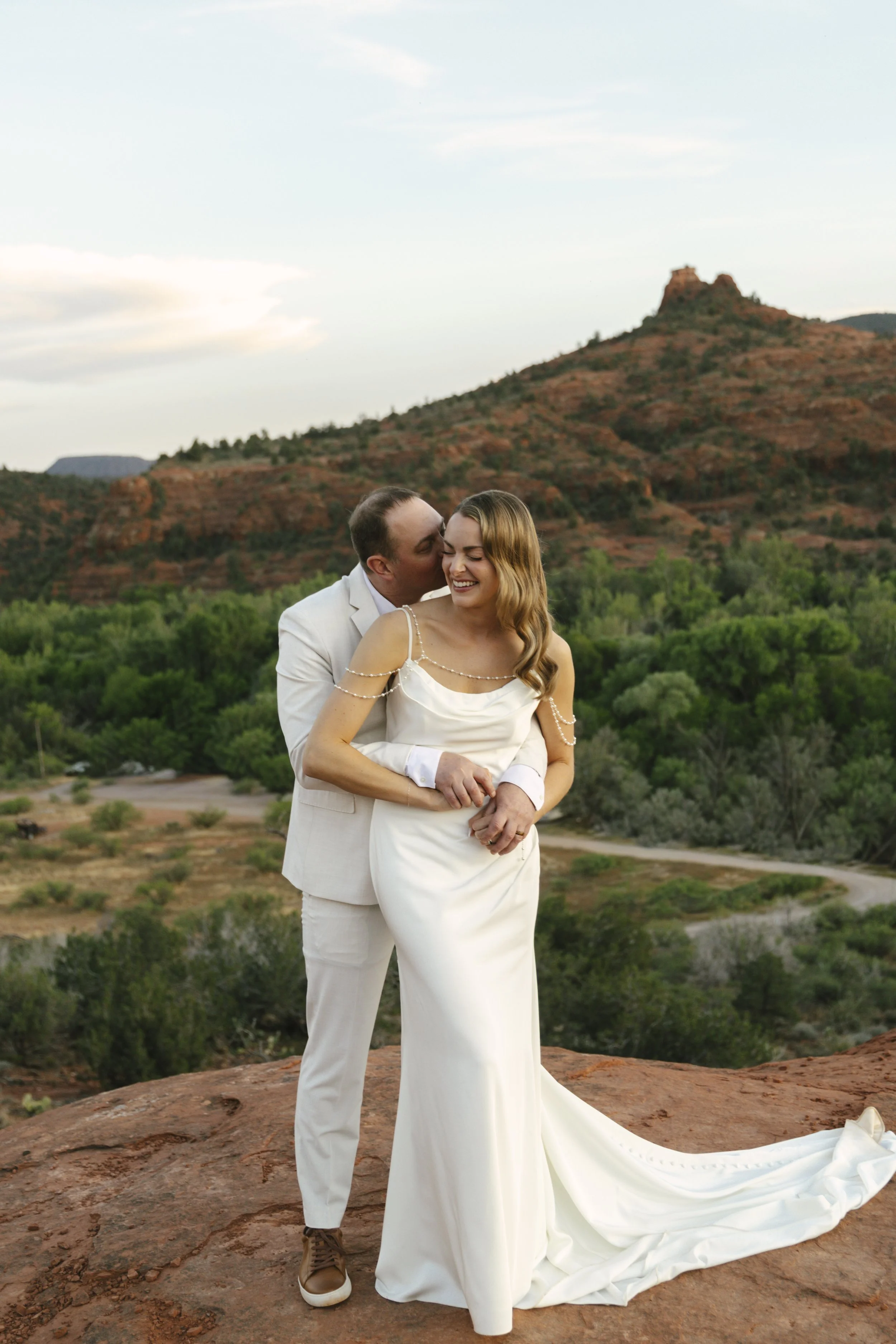 Romantic golden hour portraits at Secret Slick Rock during Chelsea and Travis' intimate Sedona elopement. Featuring Sedona's famous red rock views, stunning Arizona desert landscapes, and timeless wedding photography, these newlywed portraits perfect
