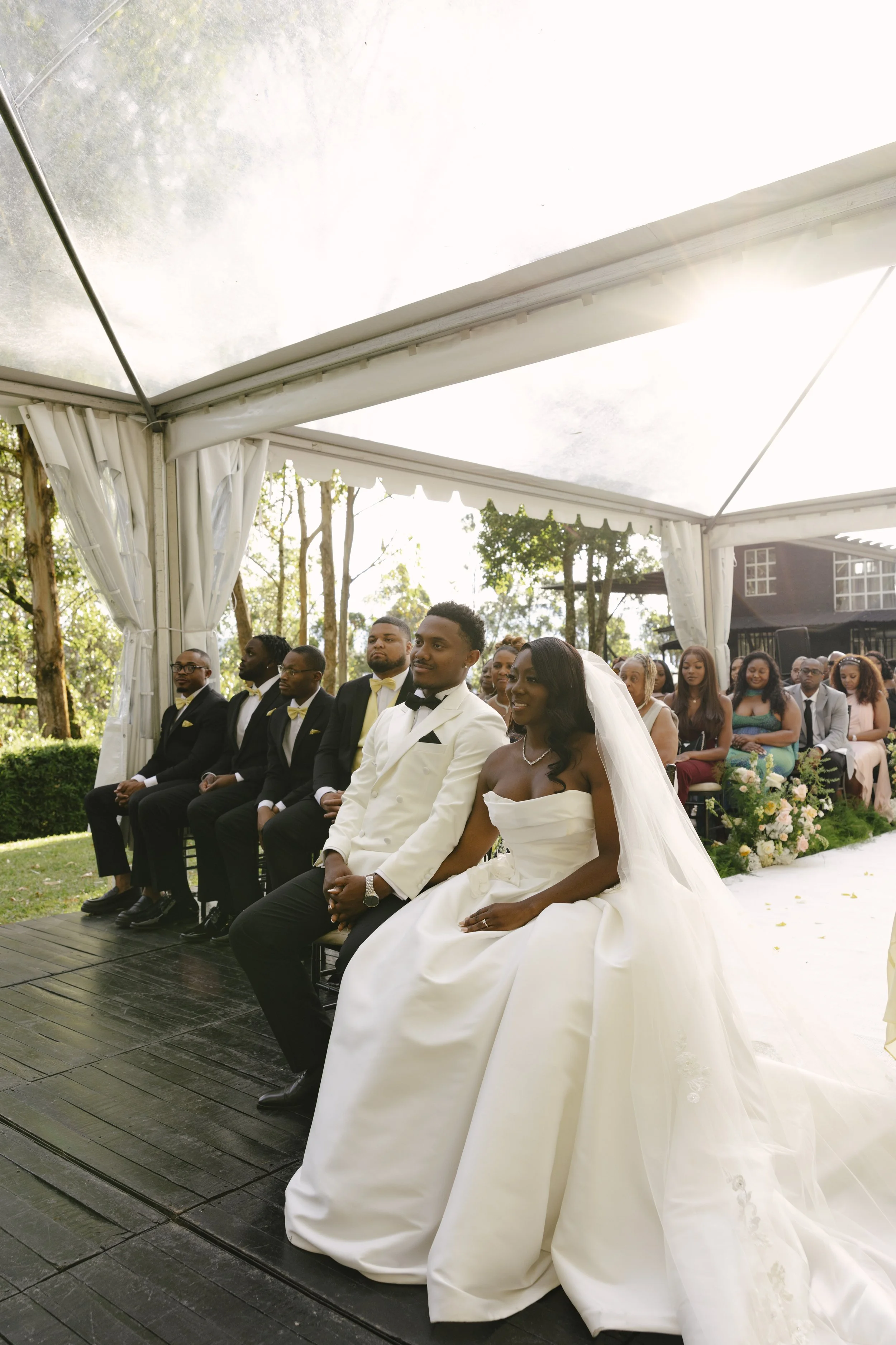 Forest Campestre wedding ceremony in Medellín, Colombia featuring the bridal processional, groom's reaction, emotional ceremony moments, floral aisle design, wedding guests, and documentary-style wedding photography