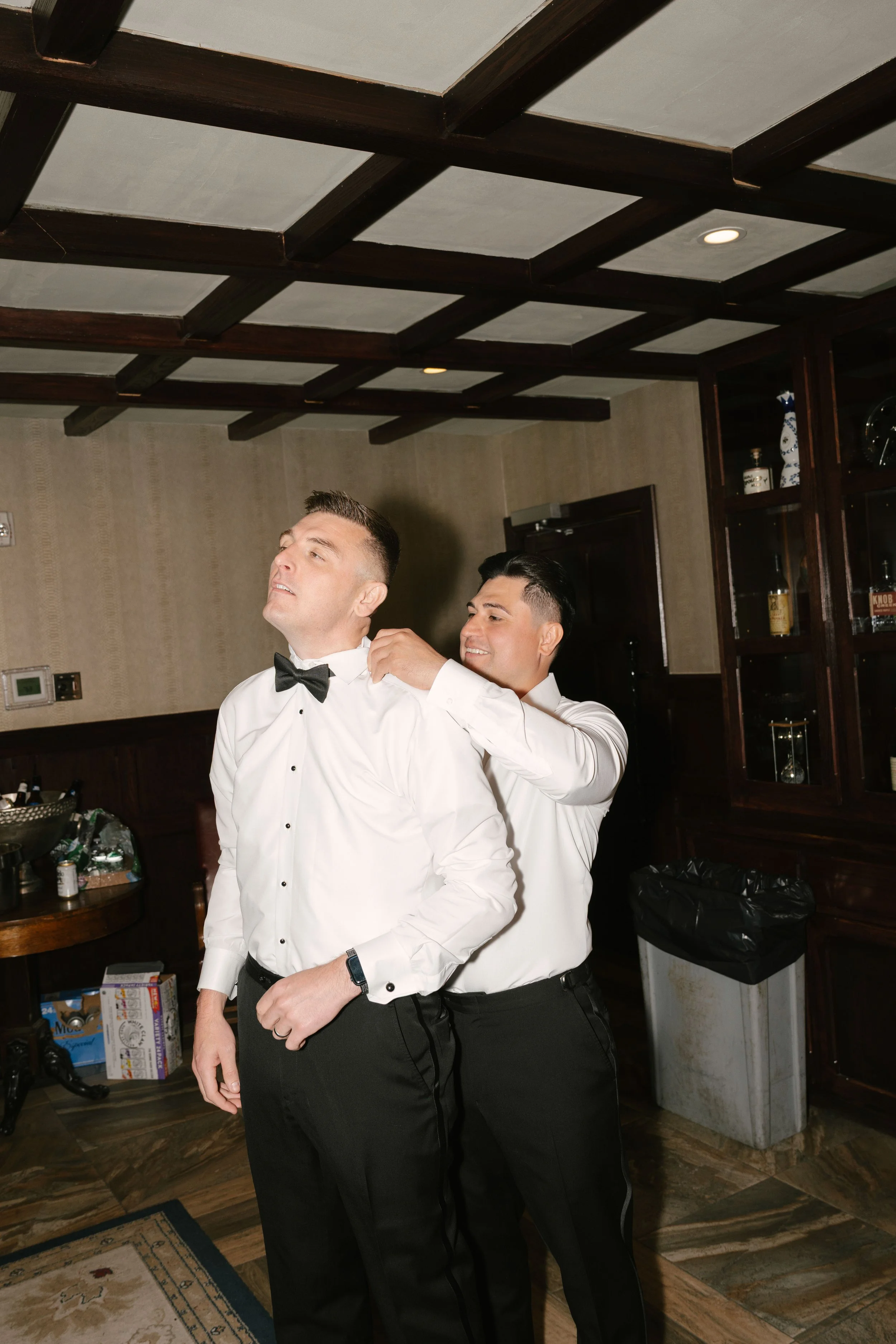 Groom getting ready at Hotel DuVillage before Andy & Elmer's May 2026 wedding. Captured by Raw By Laura using a blend of digital and 35mm film photography, documenting genuine moments with family and friends.