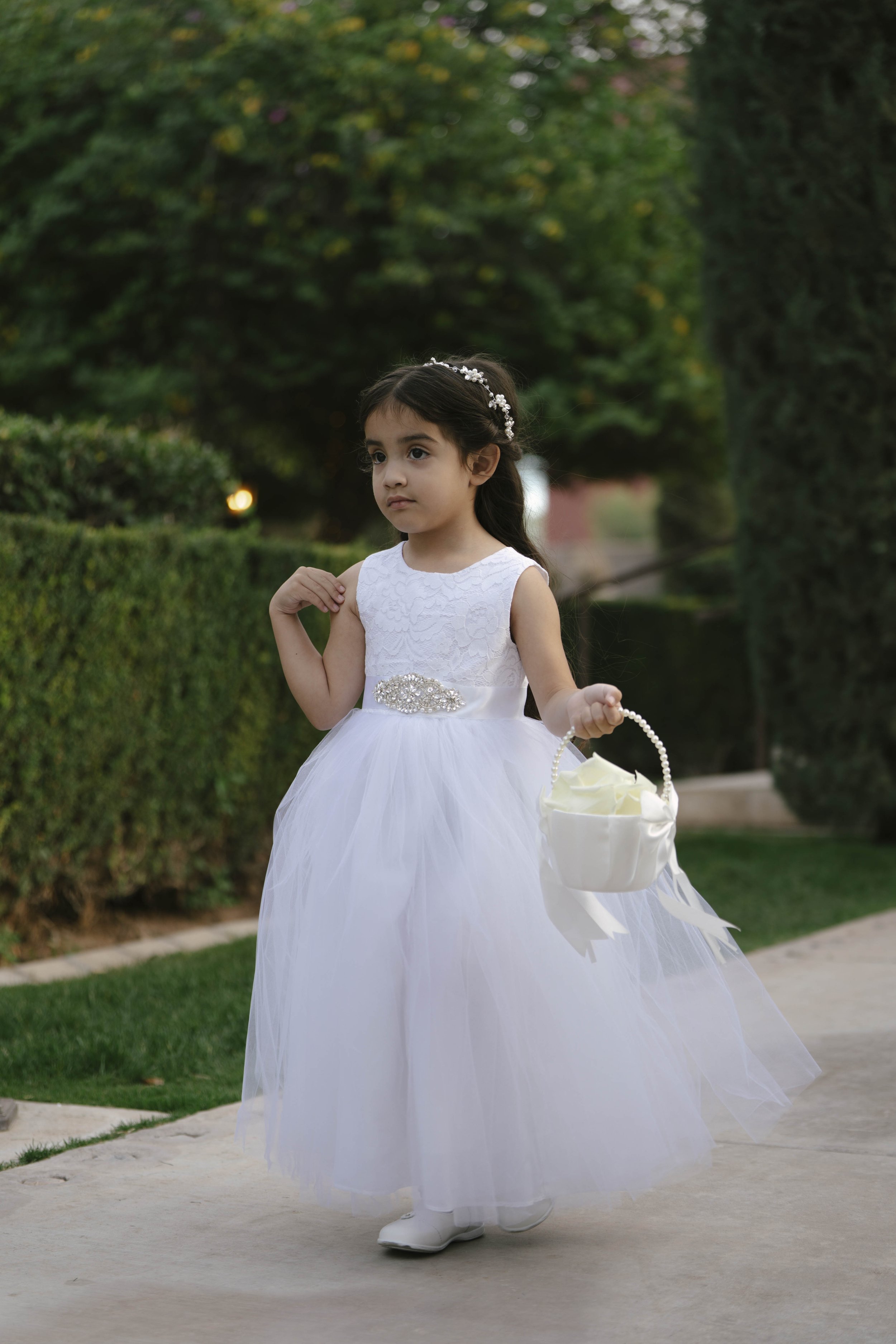 The wedding processional at Ashley Castle in Chandler, Arizona, was captured through hybrid film and digital photography, preserving the graceful entrances of the bridal party as they made their way through the romantic outdoor ceremony space surroun