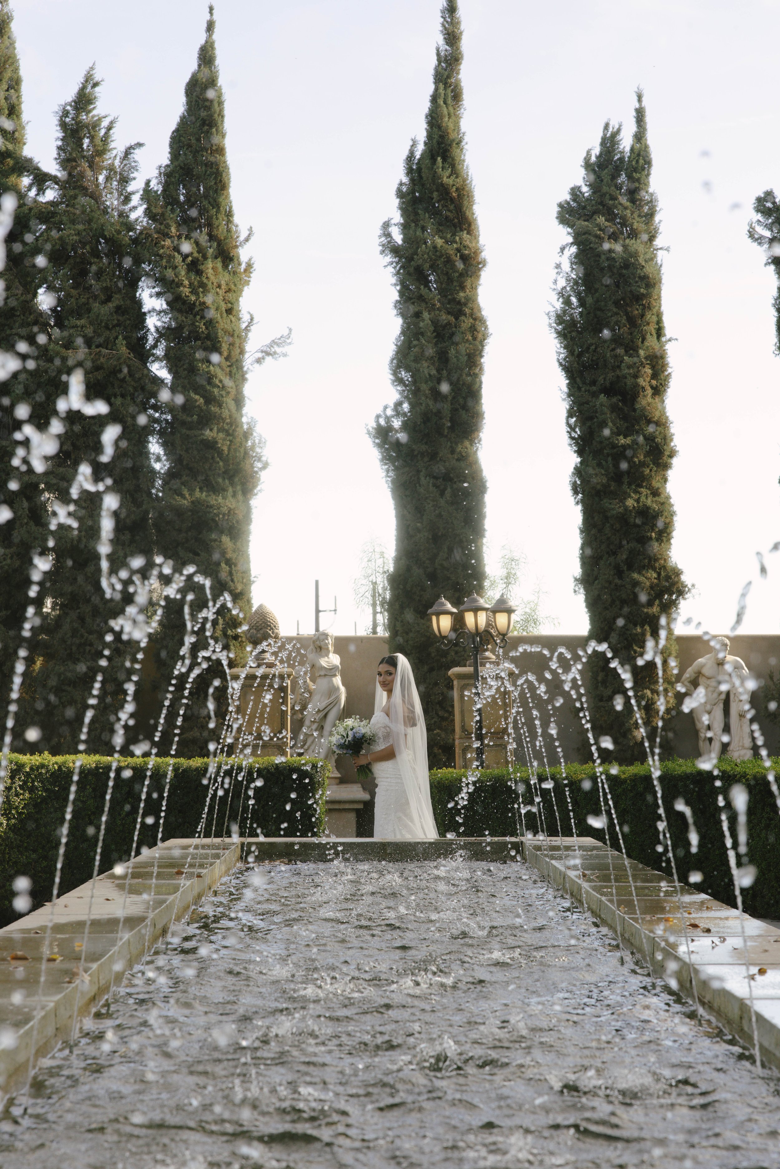 Romantic bride and groom portraits at Ashley Castle in Chandler, Arizona, captured through hybrid film and digital photography, showcase intimate newlywed moments filled with emotion, elegant garden backdrops, and timeless wedding-day connection.