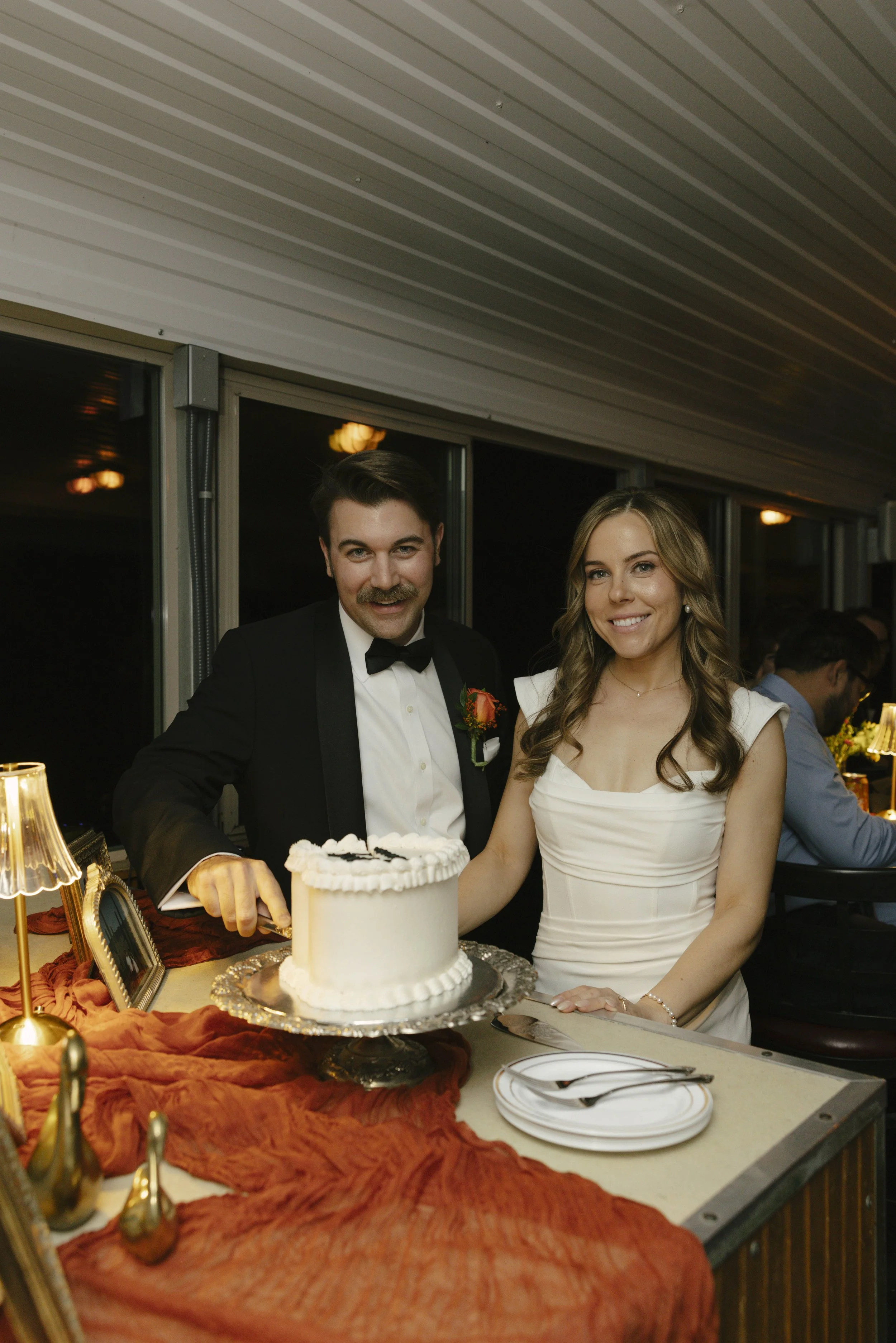To close out the evening aboard the Dolly Steamboat, the couple shared their cake cutting surrounded by family and friends. It was a sweet and joyful moment that wrapped up their Canyon Lake wedding celebration with laughter, love, and one last toast