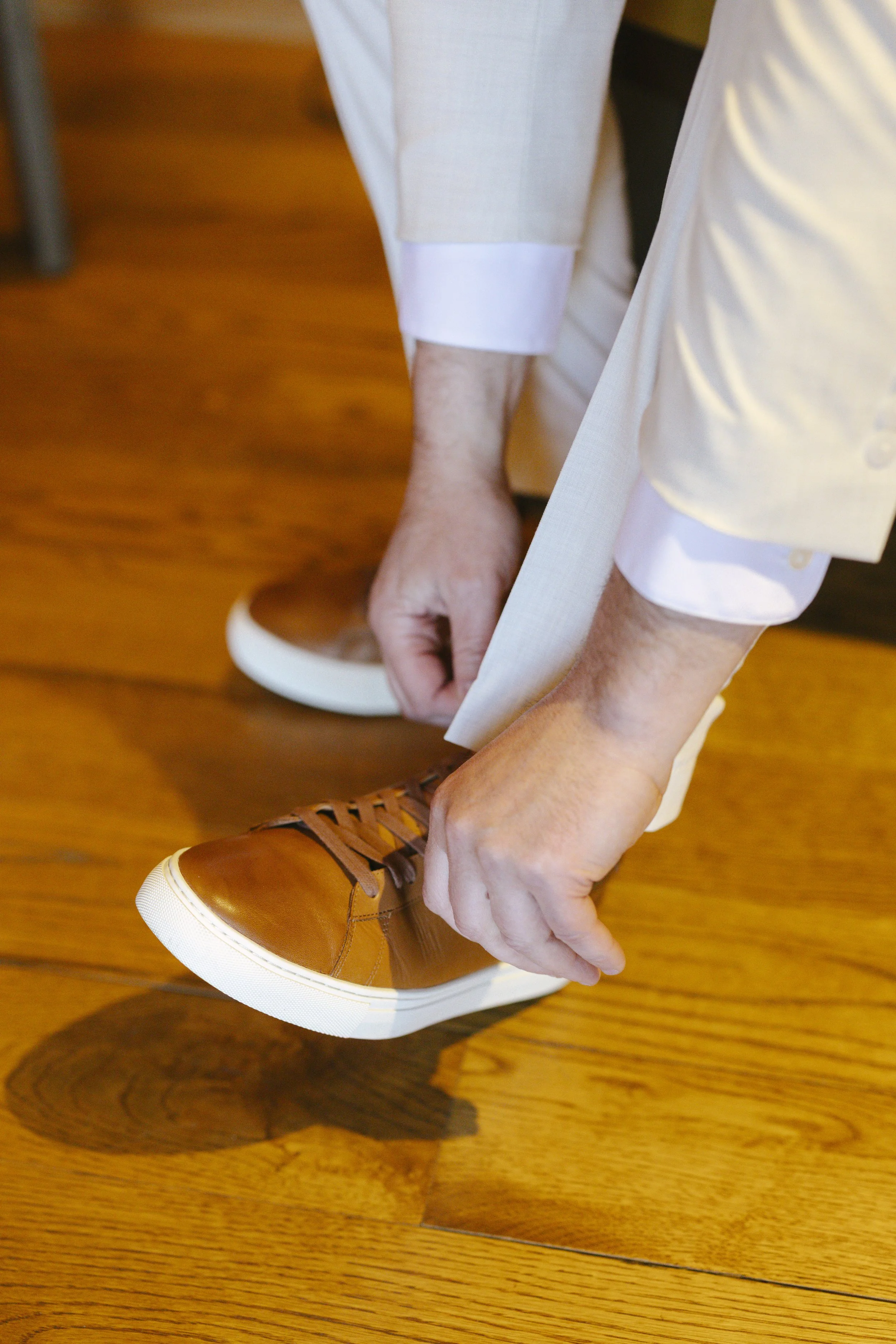 Chelsea and Travis' intimate Sedona elopement began with the groom getting ready alongside his family at a private Arizona home. From tailored wedding attire and meaningful family portraits to heartfelt moments helping him prepare, every detail refle