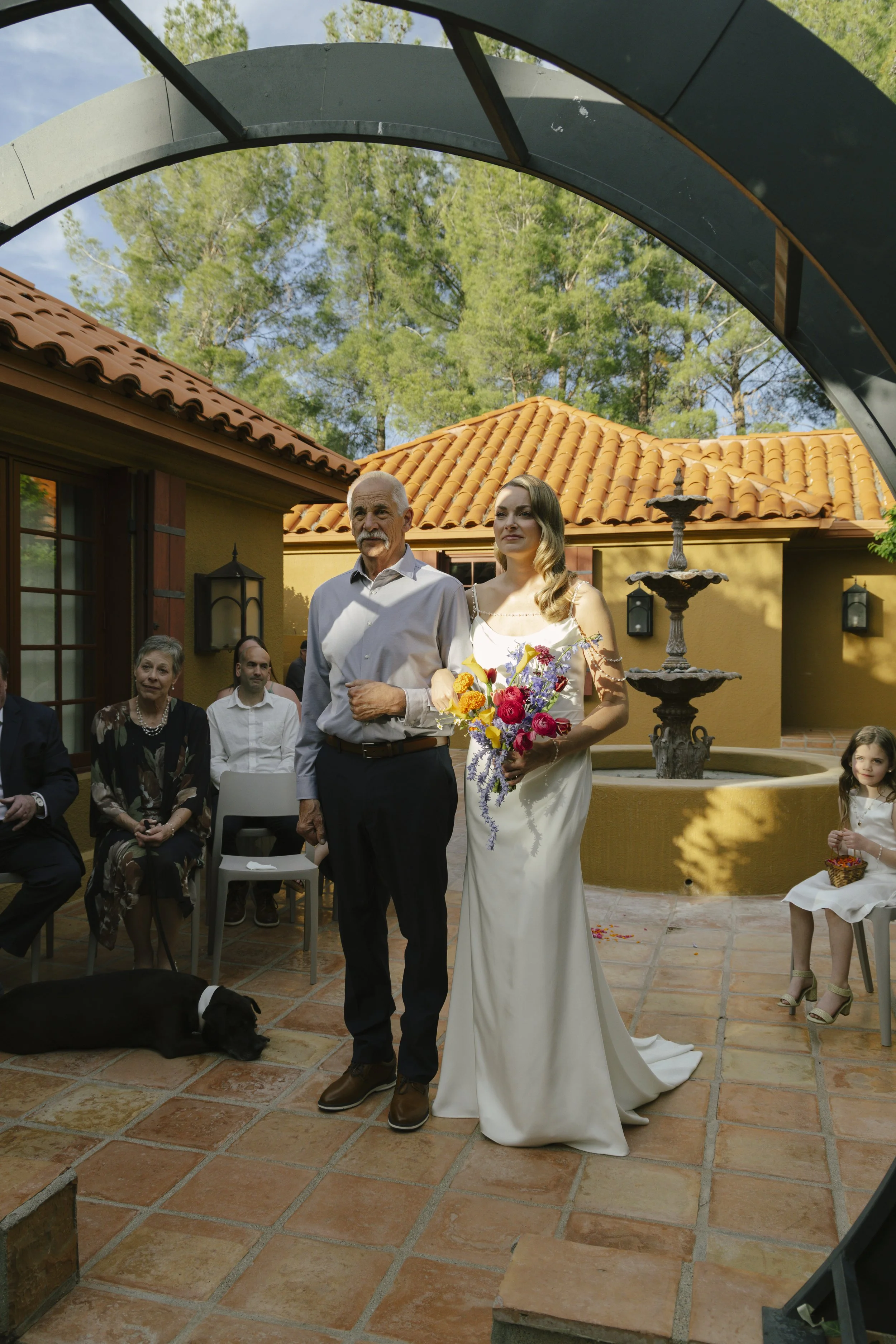 Chelsea and Travis exchanged heartfelt vows during their intimate Sedona elopement at a private Arizona home, surrounded by their closest family, friends, and beloved dog. Their outdoor ceremony was filled with meaningful moments, personal vows, and 