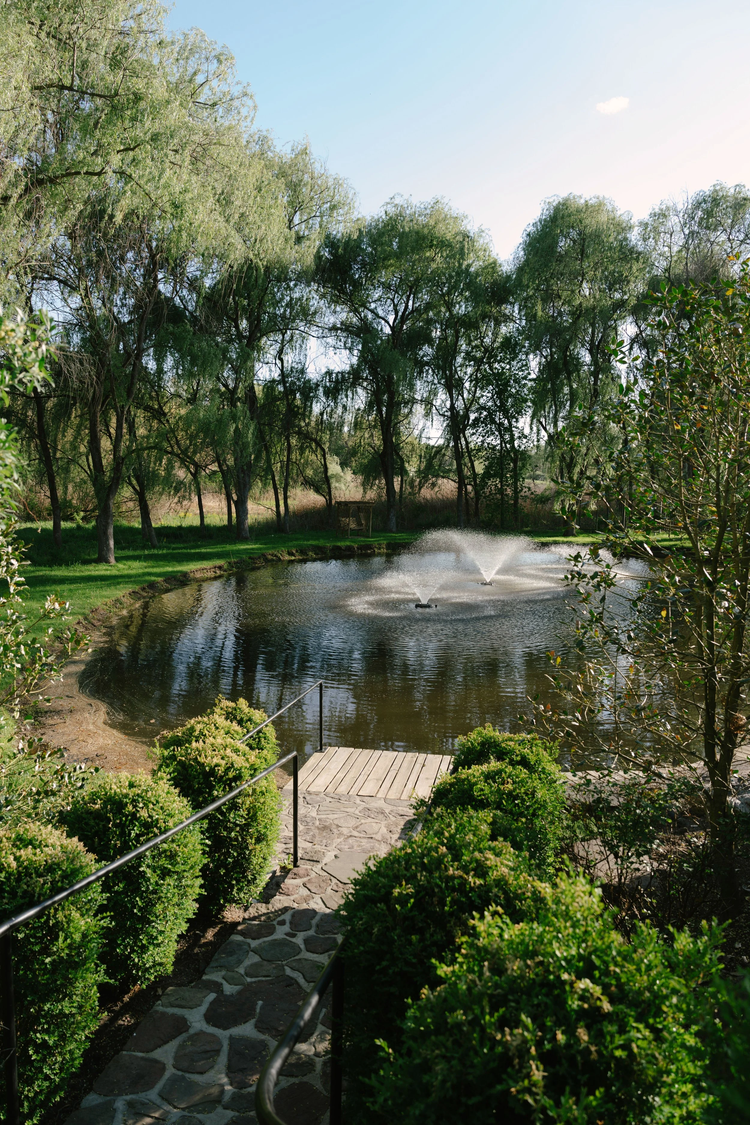 Bride and groom portraits at Hotel DuVillage showcase the venue's picturesque gardens, waterfront views, and timeless charm. Photographed on both digital and 35mm film, these wedding portraits focus on authentic connection, natural movement, and cand