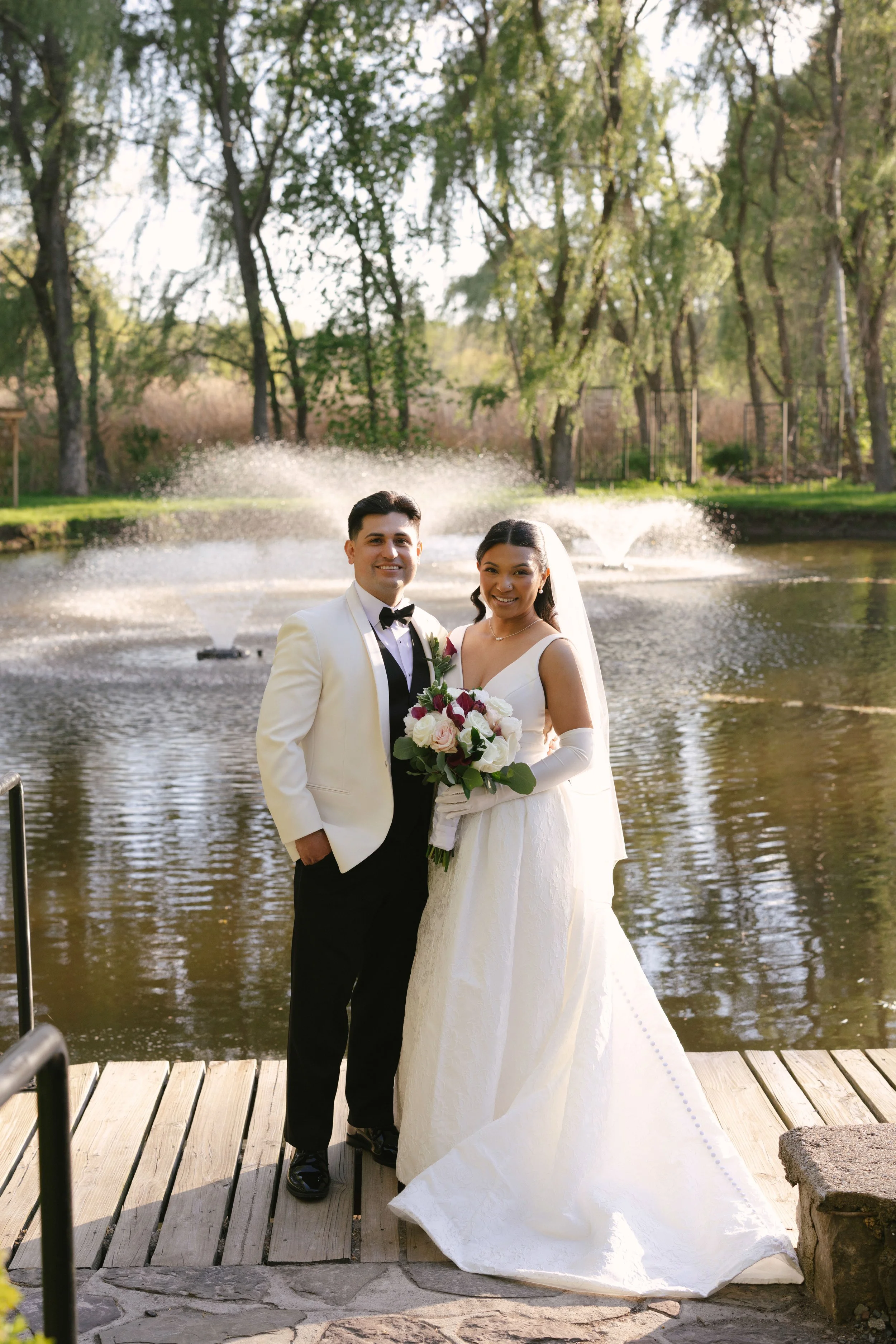 Bride and groom portraits at Hotel DuVillage showcase the venue's picturesque gardens, waterfront views, and timeless charm. Photographed on both digital and 35mm film, these wedding portraits focus on authentic connection, natural movement, and cand