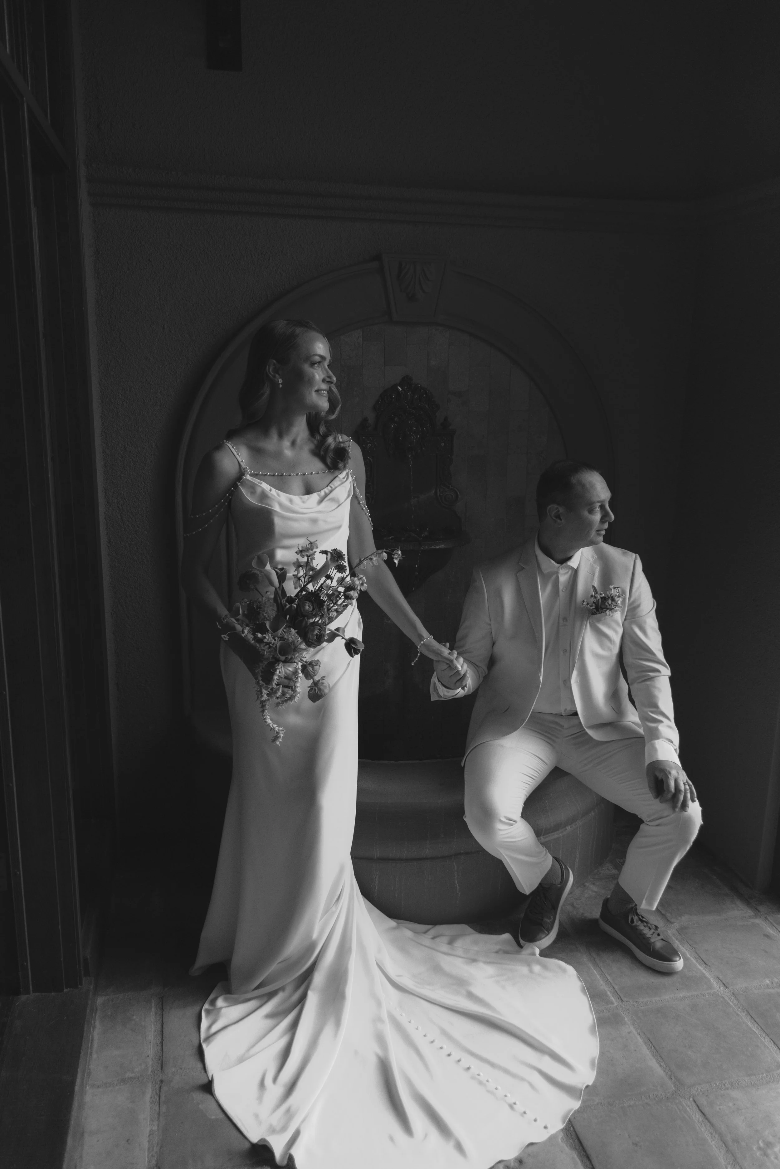 Romantic newlywed portraits from Chelsea and Travis' intimate Sedona, Arizona elopement, featuring elegant courtyard portraits, candid moments with their beloved dog, and timeless wedding photography captured after their private ceremony before golde