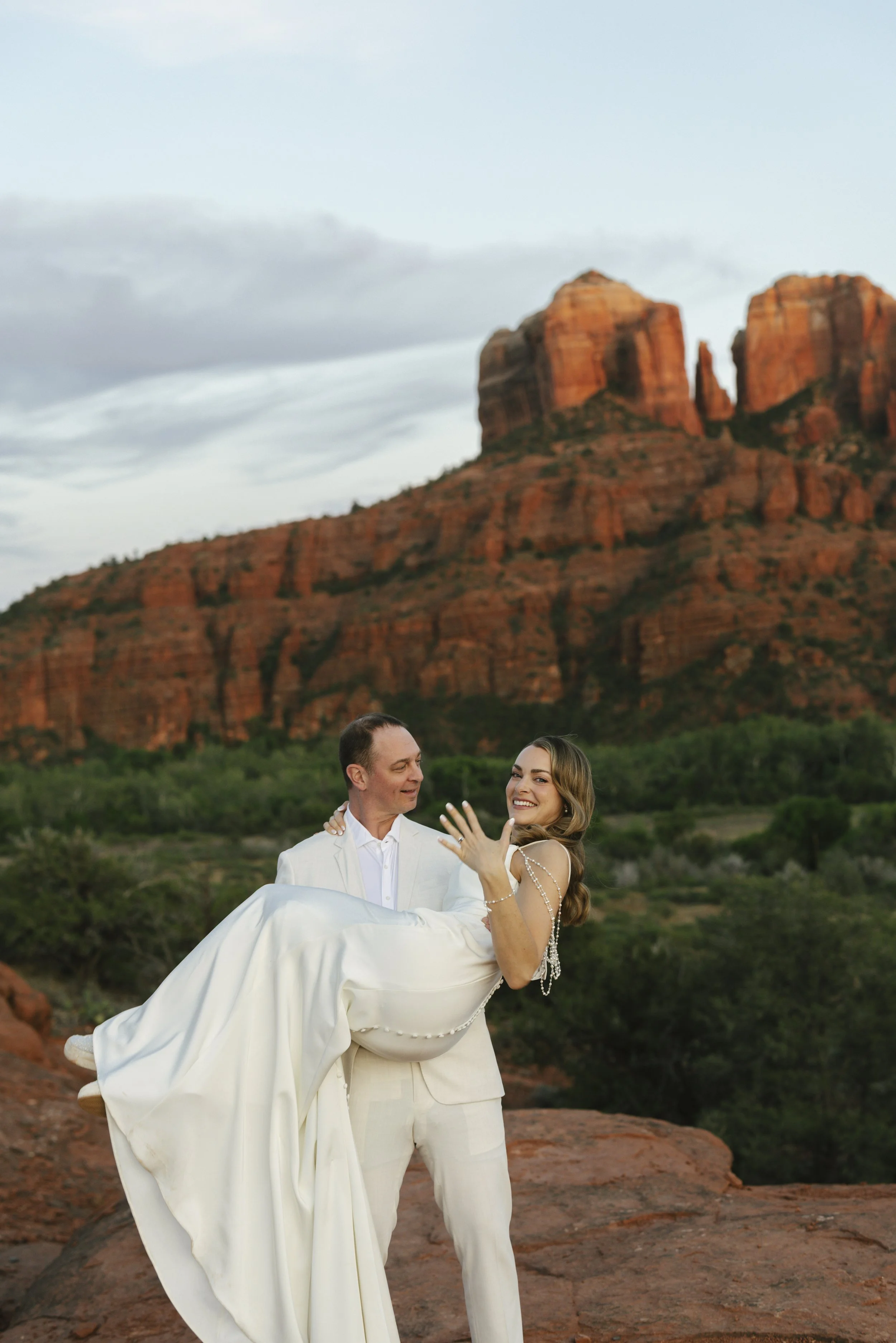 Romantic golden hour portraits at Secret Slick Rock during Chelsea and Travis' intimate Sedona elopement. Featuring Sedona's famous red rock views, stunning Arizona desert landscapes, and timeless wedding photography, these newlywed portraits perfect