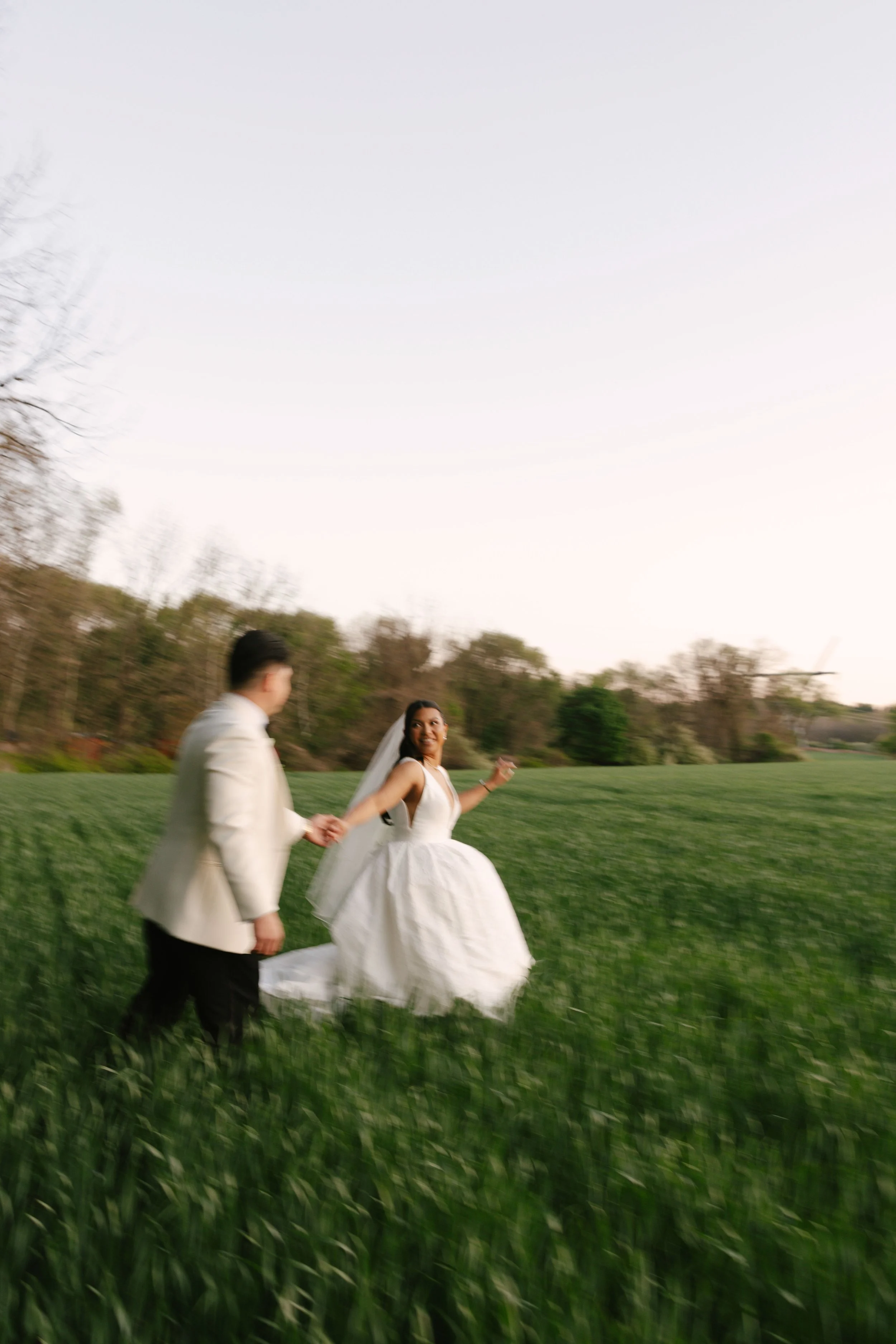 As the sun began to set, the bride and groom stepped away for golden hour portraits around the grounds of Hotel DuVillage. Captured on both digital and 35mm film, these sunset portraits highlight the warmth, romance, and quiet moments shared between 