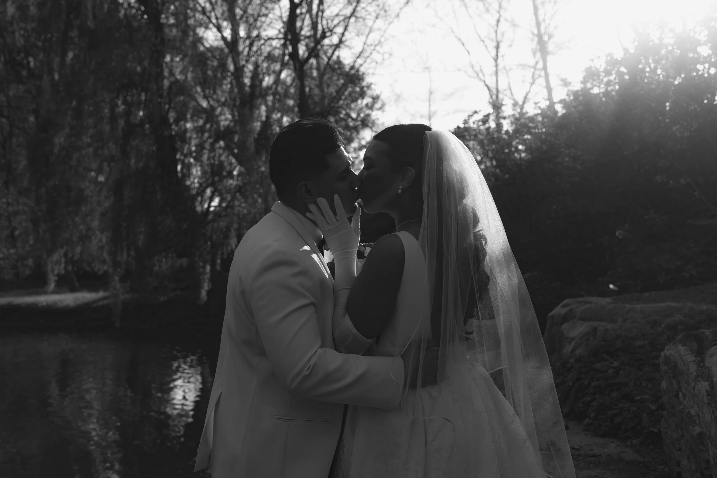 Bride and groom portraits at Hotel DuVillage showcase the venue's picturesque gardens, waterfront views, and timeless charm. Photographed on both digital and 35mm film, these wedding portraits focus on authentic connection, natural movement, and cand