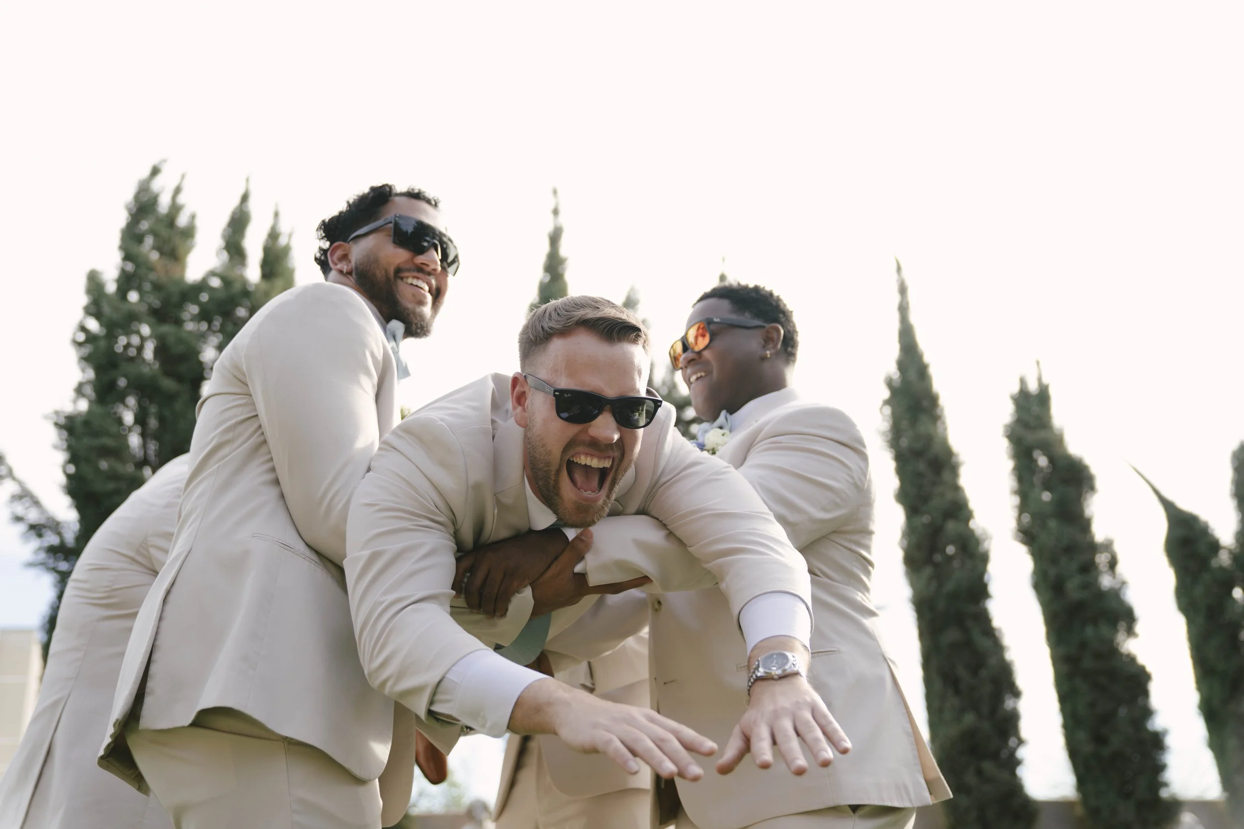 The bridal party portraits at Ashley Castle in Chandler, Arizona, brought playful energy and celebration to the day, with hybrid film and digital photography capturing candid laughter, stylish group moments, and unforgettable memories with the bride,