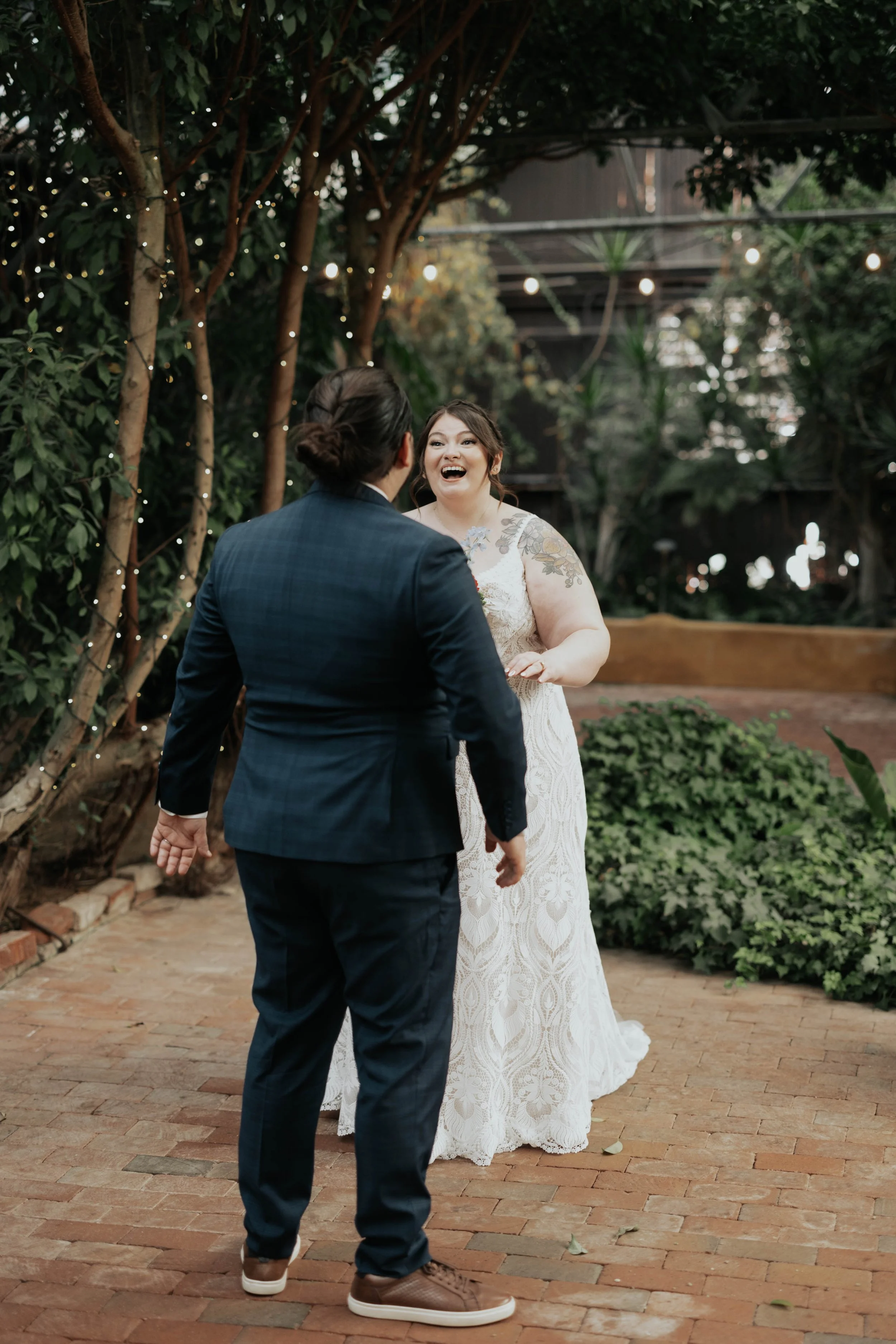 Before the ceremony, Lauren and Joel shared a joyful first look surrounded by the lush greenery of the Boojum Tree in Phoenix. These quiet moments together allowed them to take in the excitement of the day while capturing relaxed portraits before cel